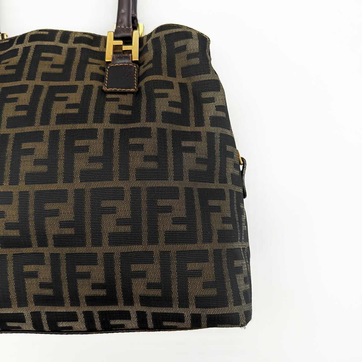 Fendi Zucca FF Monogram Handbag in brown canvas with leather handles and gold hardware, displayed against a clean background.