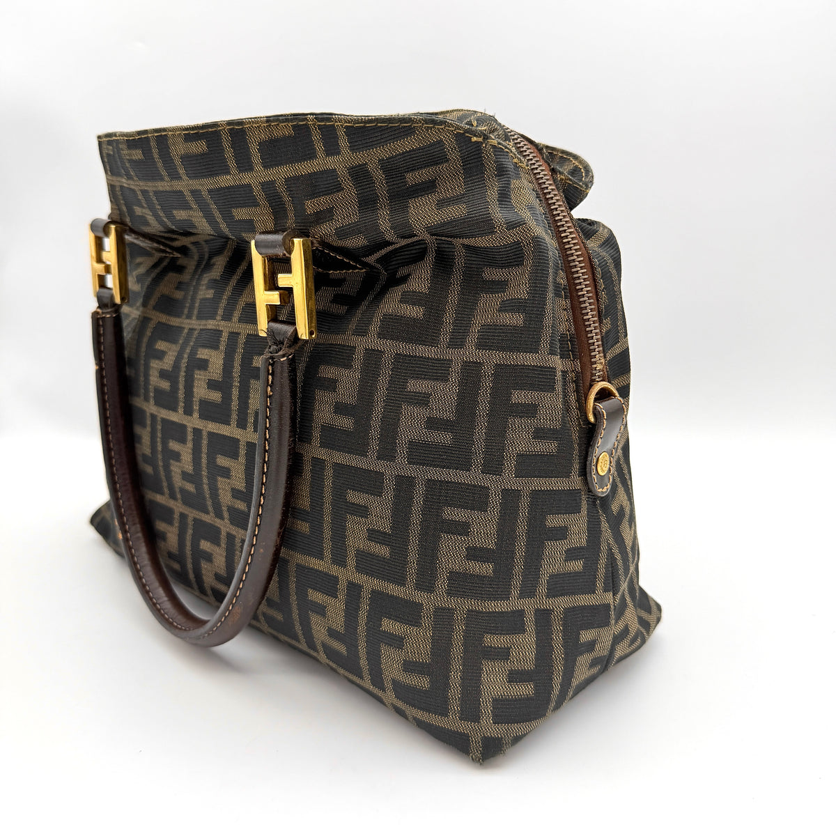 Fendi Zucca FF Monogram Handbag in brown canvas with leather handles and gold hardware, displayed against a clean background.