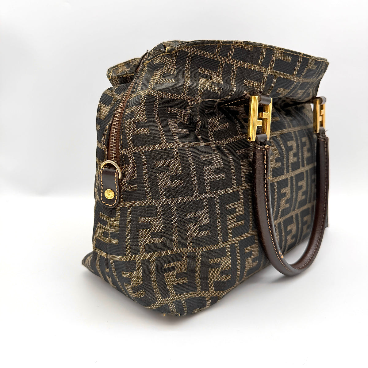Fendi Zucca FF Monogram Handbag in brown canvas with leather handles and gold hardware, displayed against a clean background.