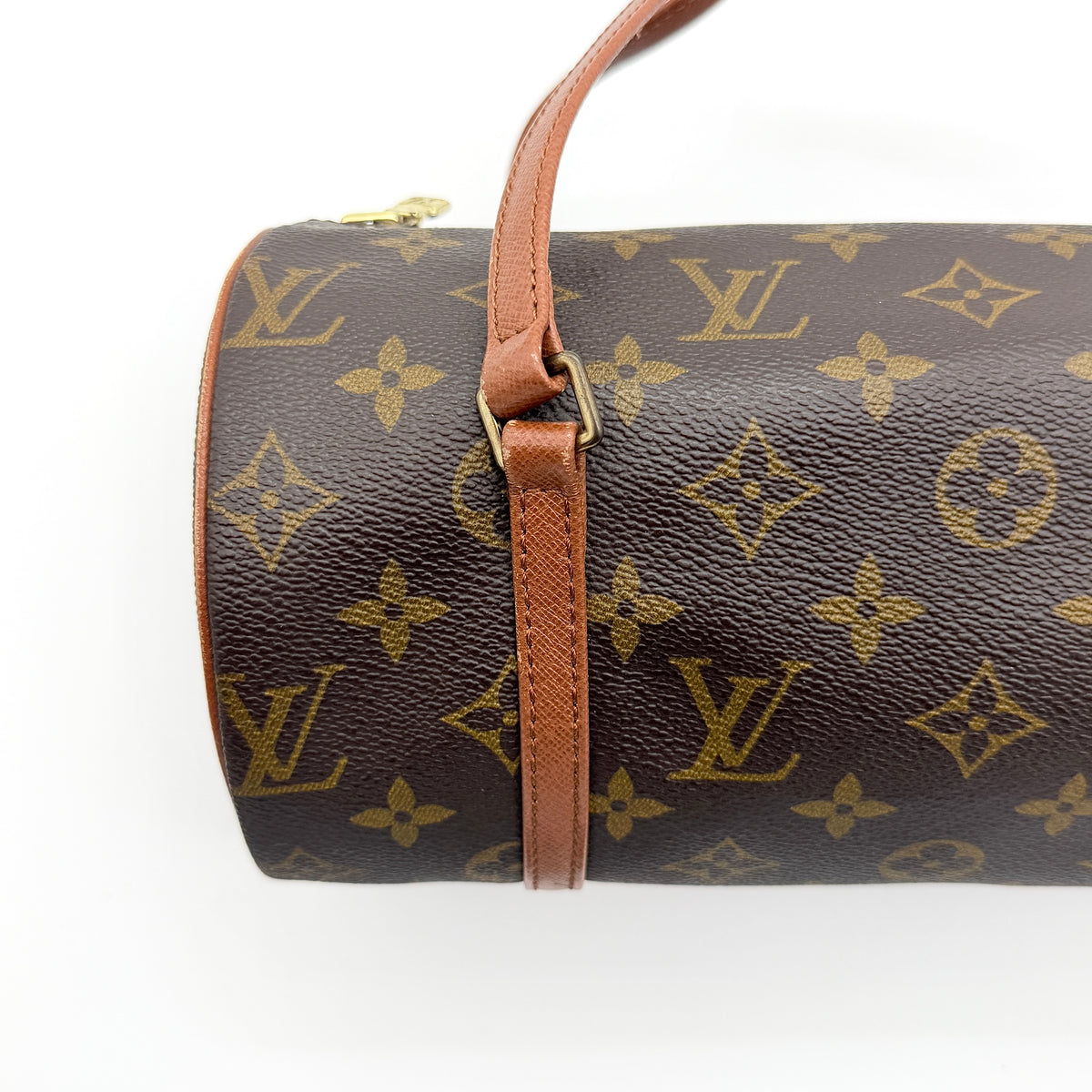 Louis Vuitton Papillon 26 in monogram canvas with leather handles and gold zipper, shown on a white background.