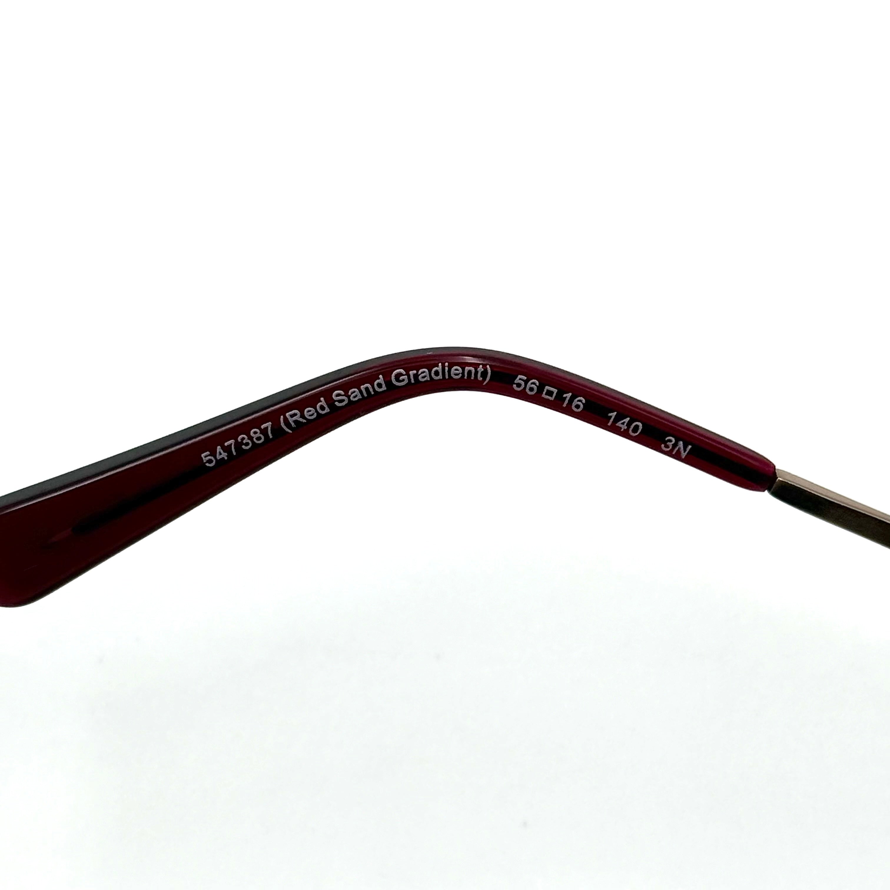 Coach HC8214F sunglasses in a red-to-sand gradient acetate frame with gold-tone metal temples and signature carriage detail.