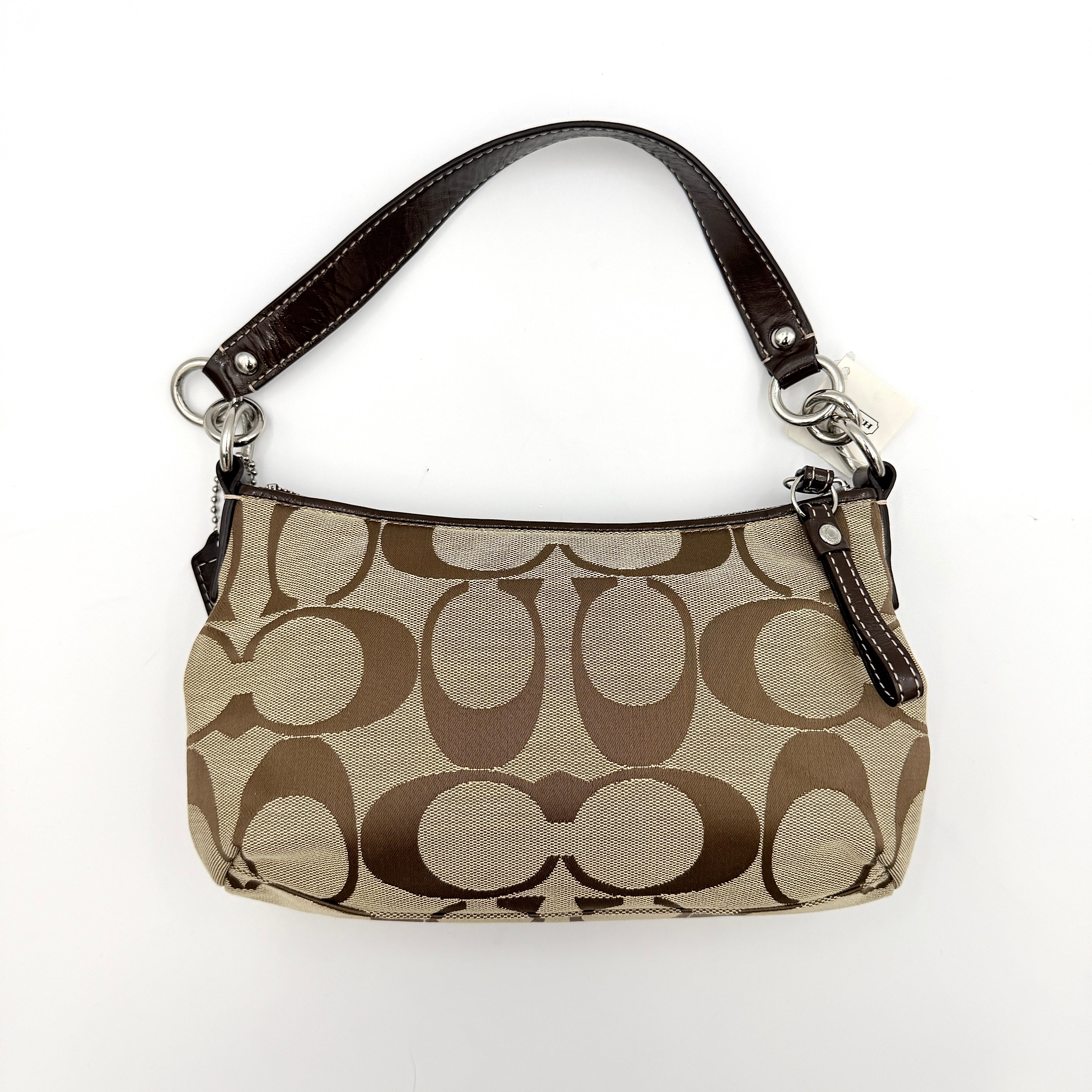 Coach khaki and mahogany signature jacquard shoulder bag with detachable strap and silver hardware displayed on a white background.