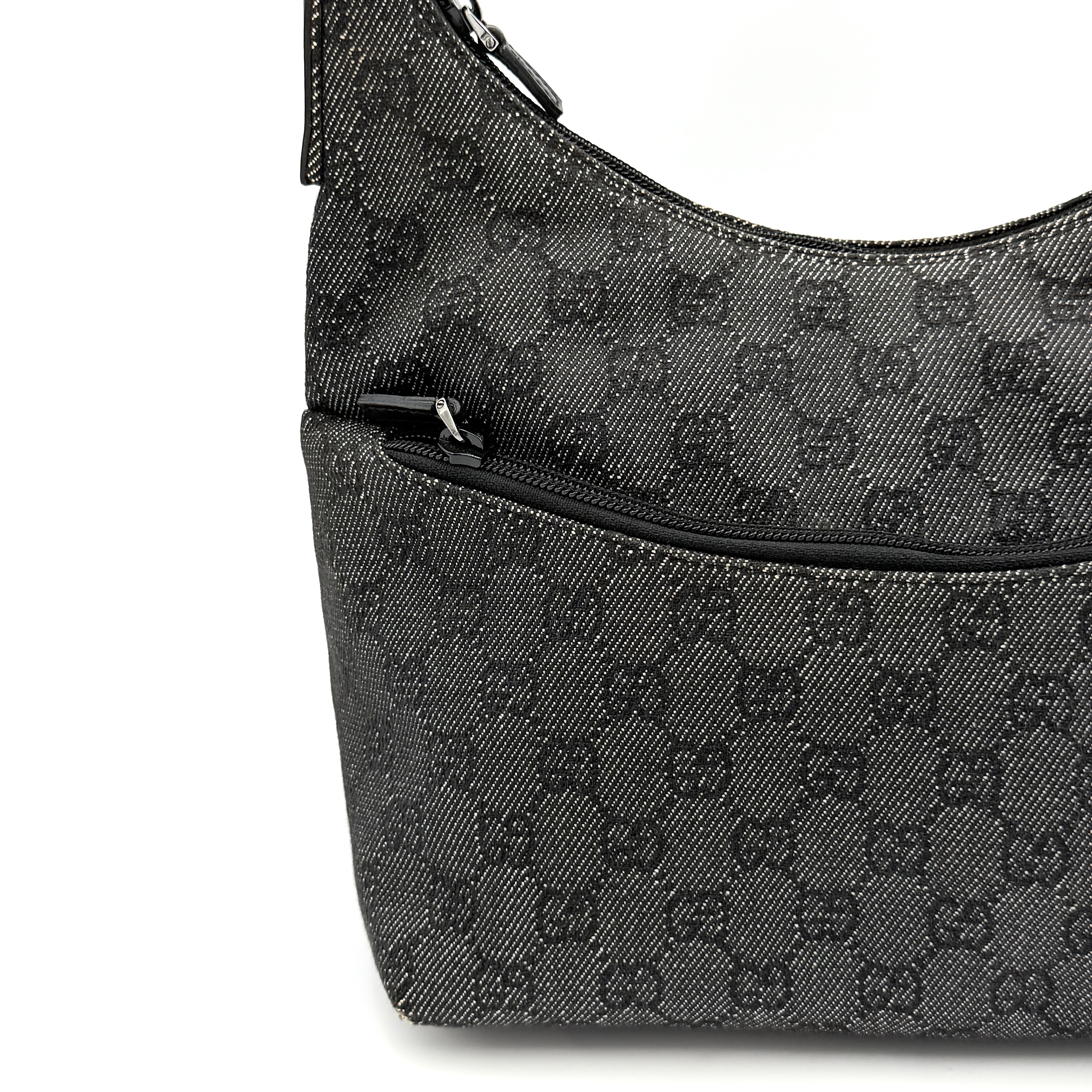 Gucci GG Monogram Hobo Shoulder Bag in black canvas with tonal GG pattern and a curved shoulder strap, photographed on a white background.