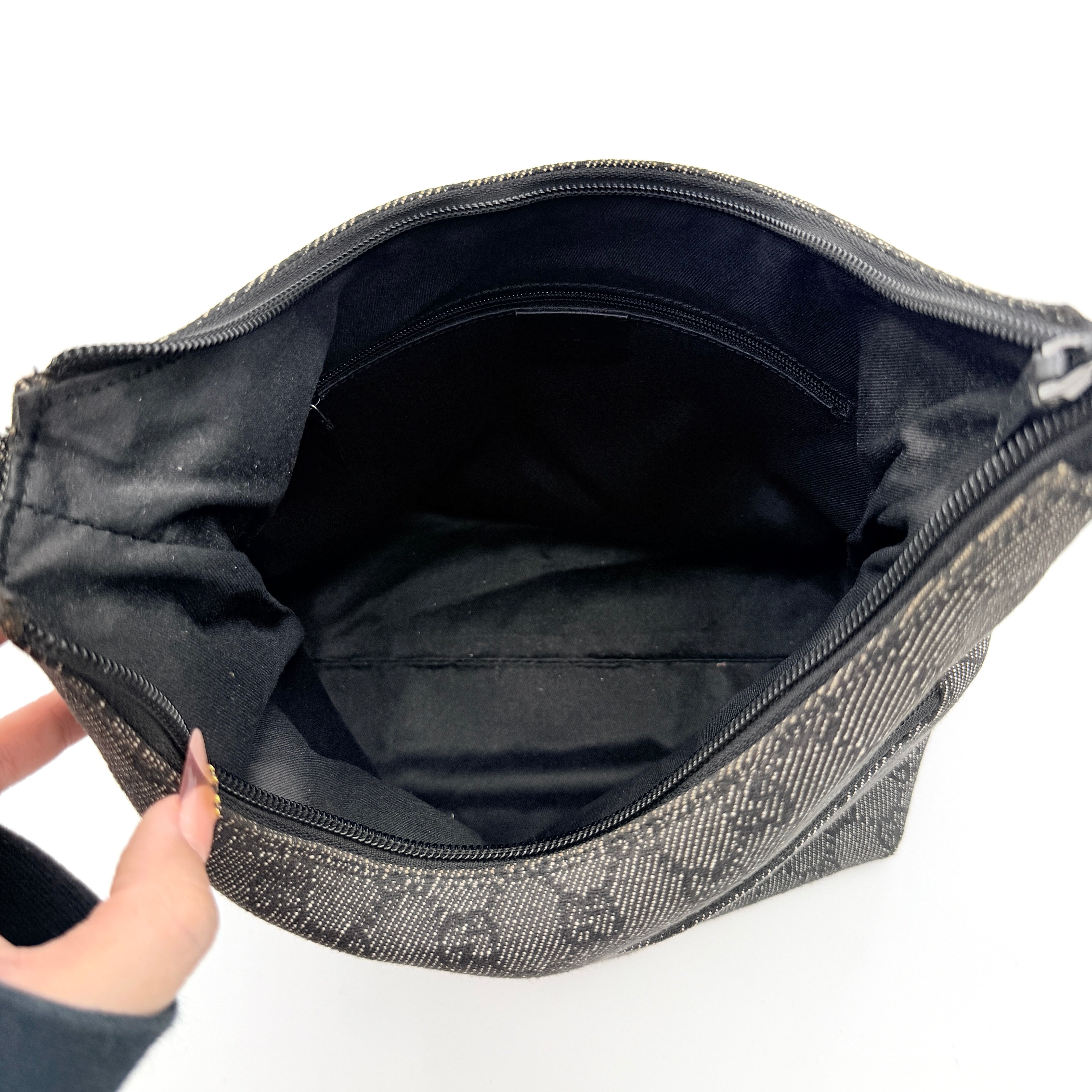 Gucci GG Monogram Hobo Shoulder Bag in black canvas with tonal GG pattern and a curved shoulder strap, photographed on a white background.