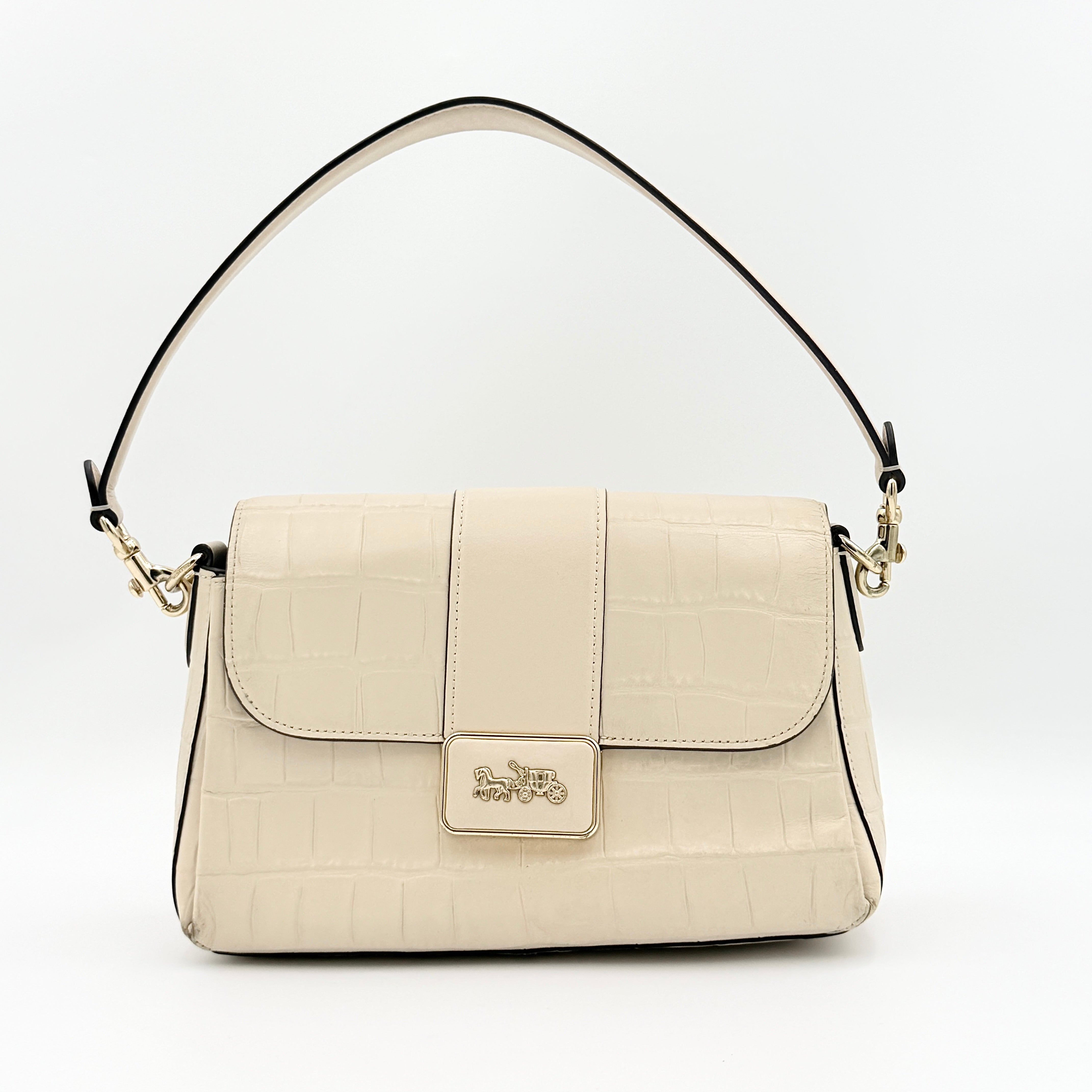Coach Grace Shoulder Bag in ivory croc-embossed leather with gold-tone carriage plaque and structured shoulder strap.