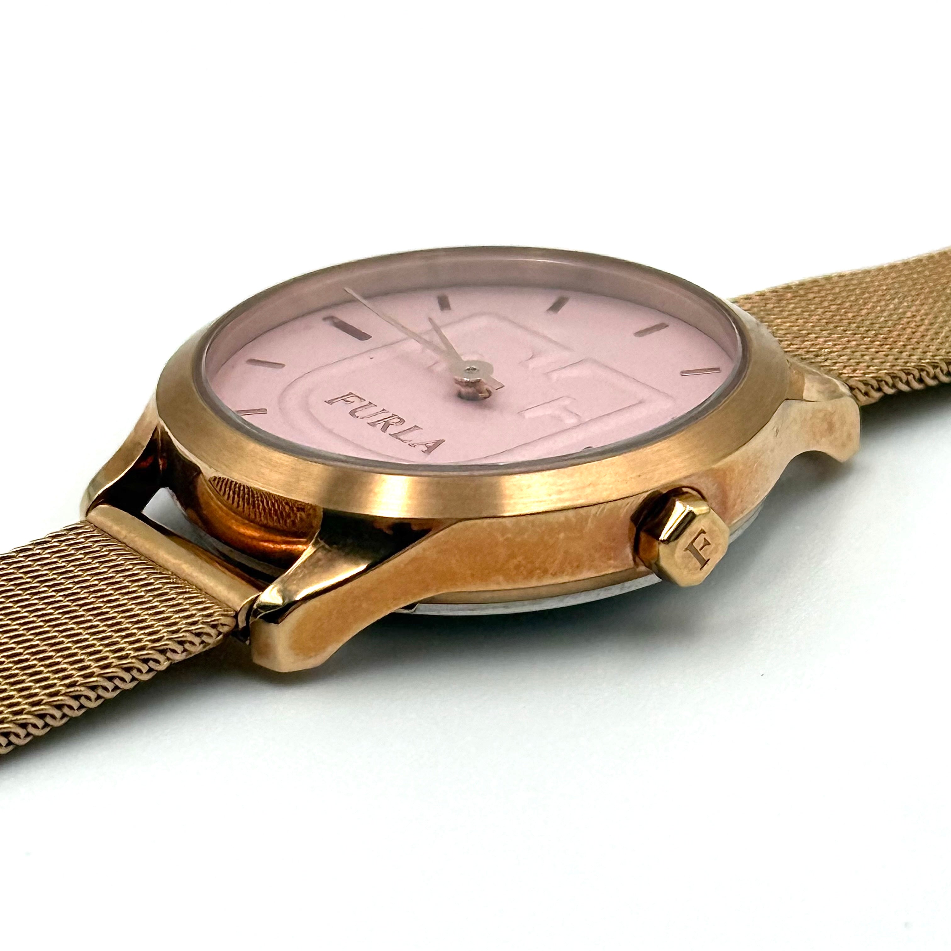 Furla WR 5 ATM watch with pink dial and rose gold Milanese mesh strap displayed on a black cushion.