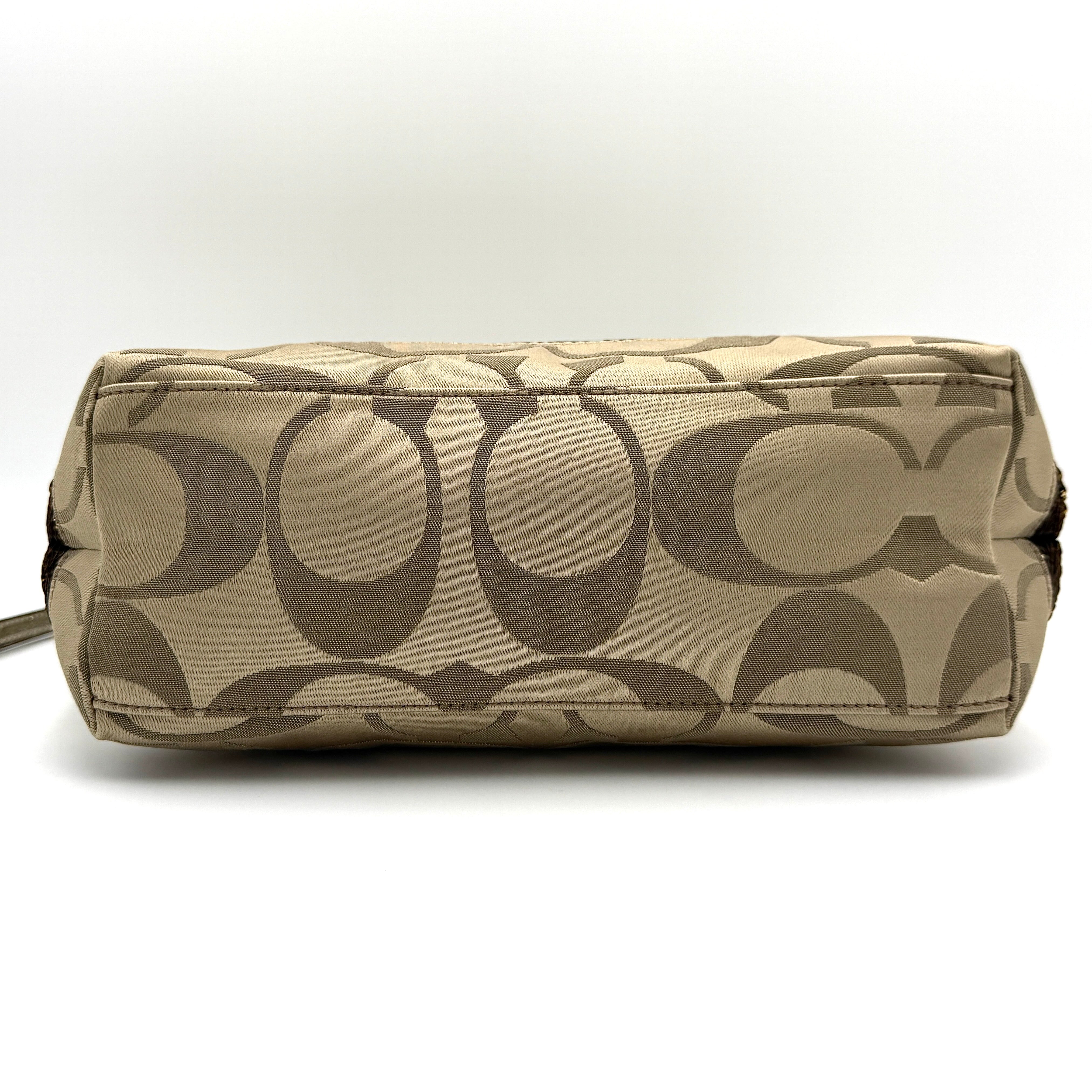 Coach Signature Stripe Tote Bag in gold and beige canvas with metallic gold leather trim and double handles.