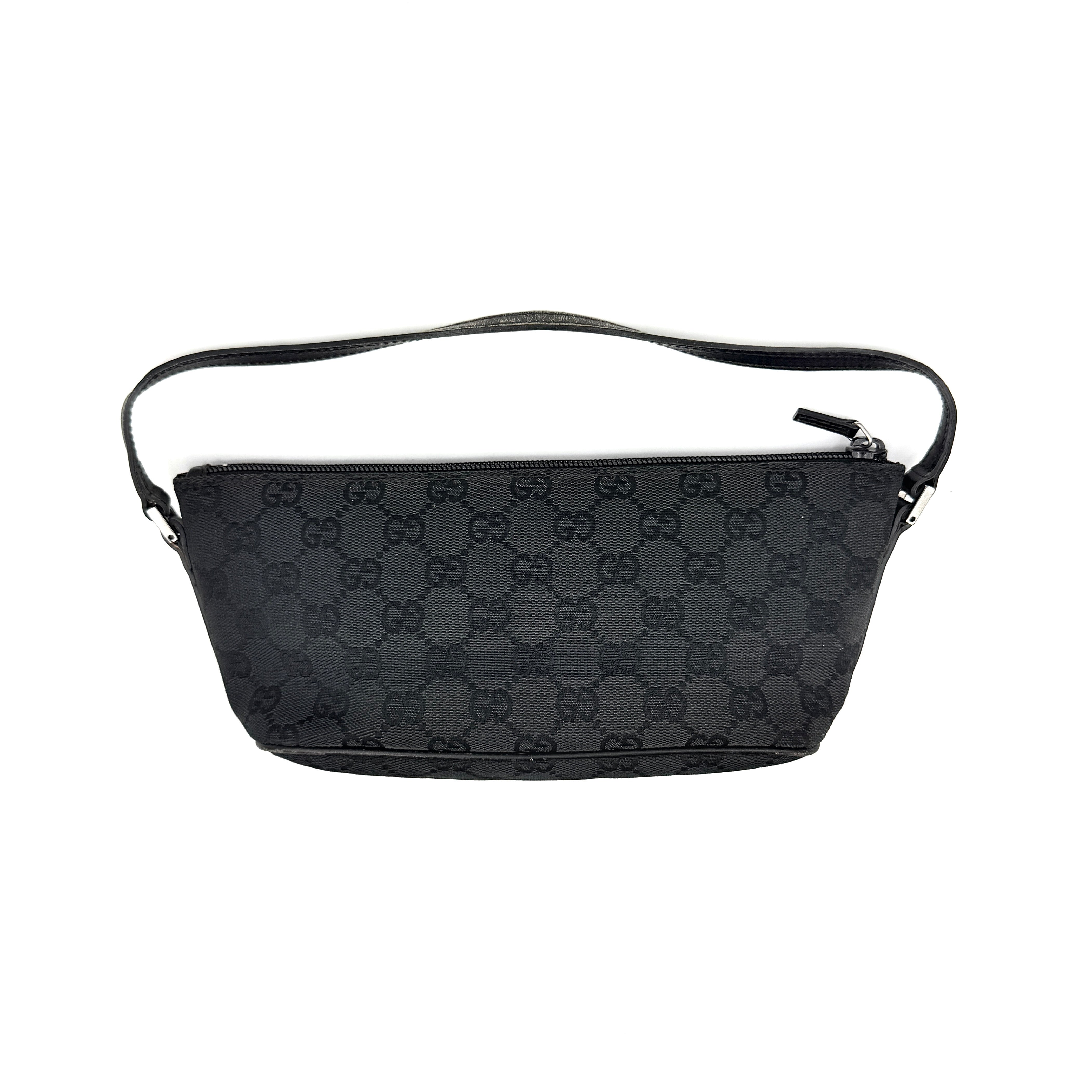 The Gucci GG Monogram Pochette Boat Shoulder Bag in black canvas with leather trim and silver-tone hardware, shown from the front with its structured, compact shape.