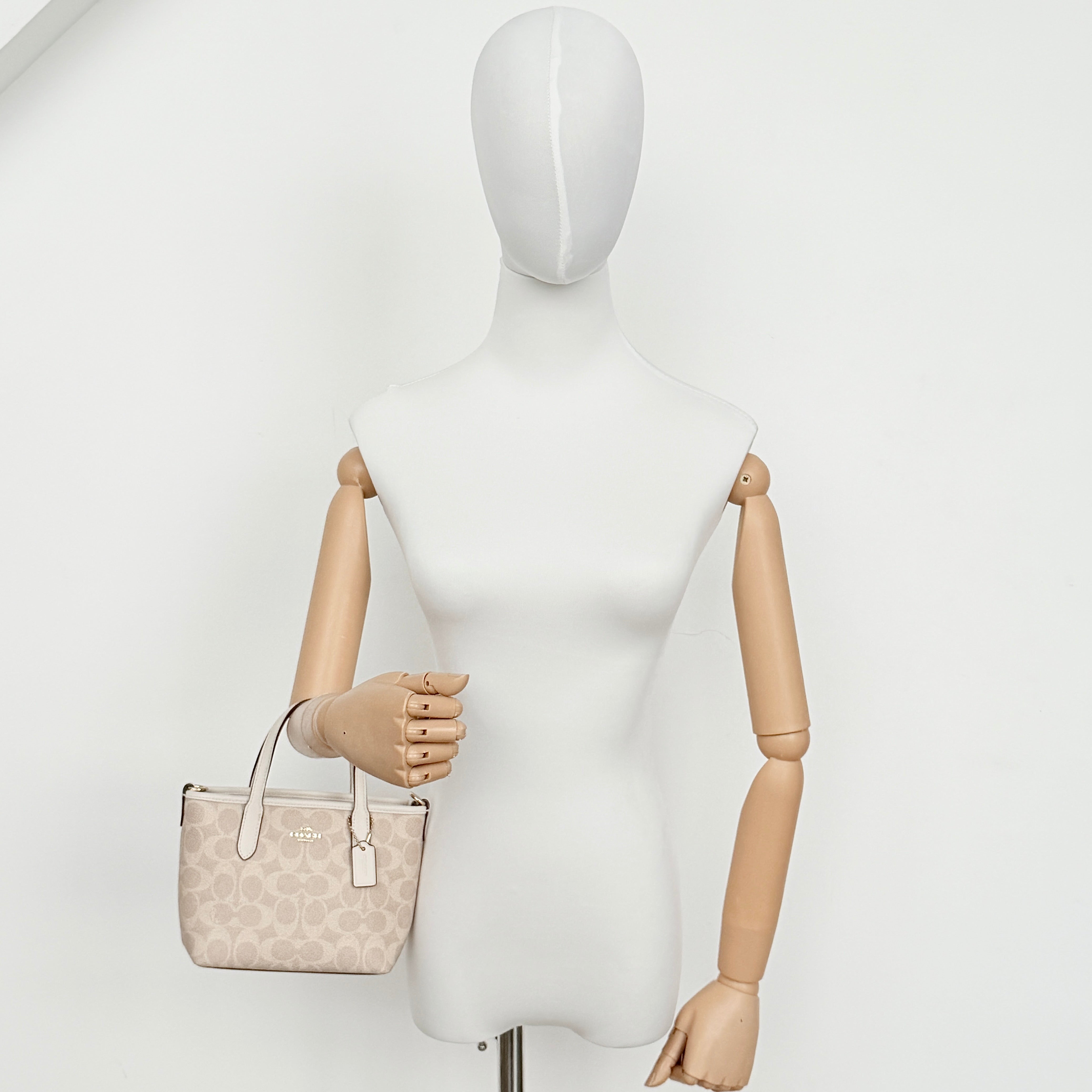 Coach 2Way Mini City Tote in beige and white with signature jacquard, shown with detachable logo canvas strap.