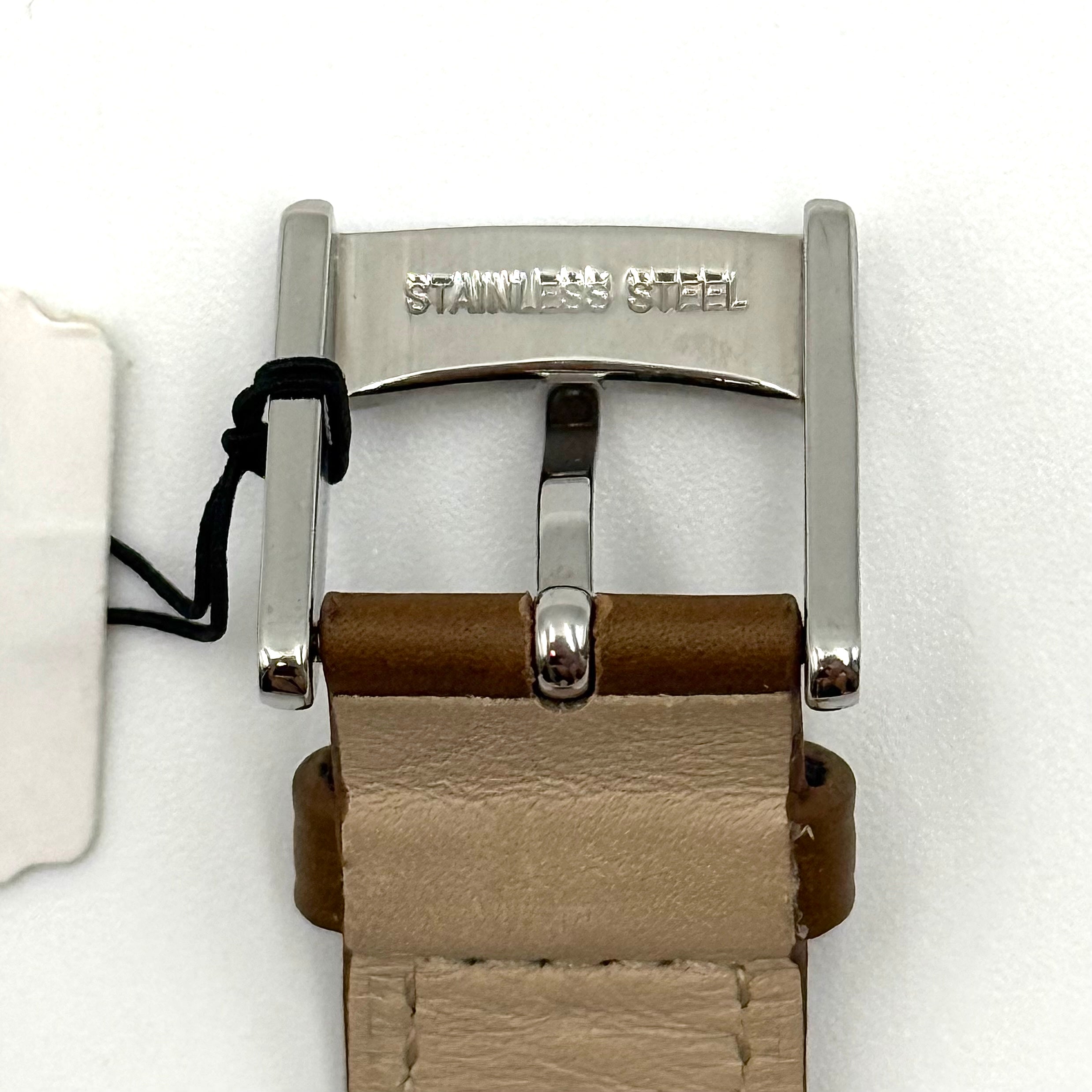 Marc Jacobs Courtney watch with silver stainless steel case and brown leather strap shown on a black cushion.