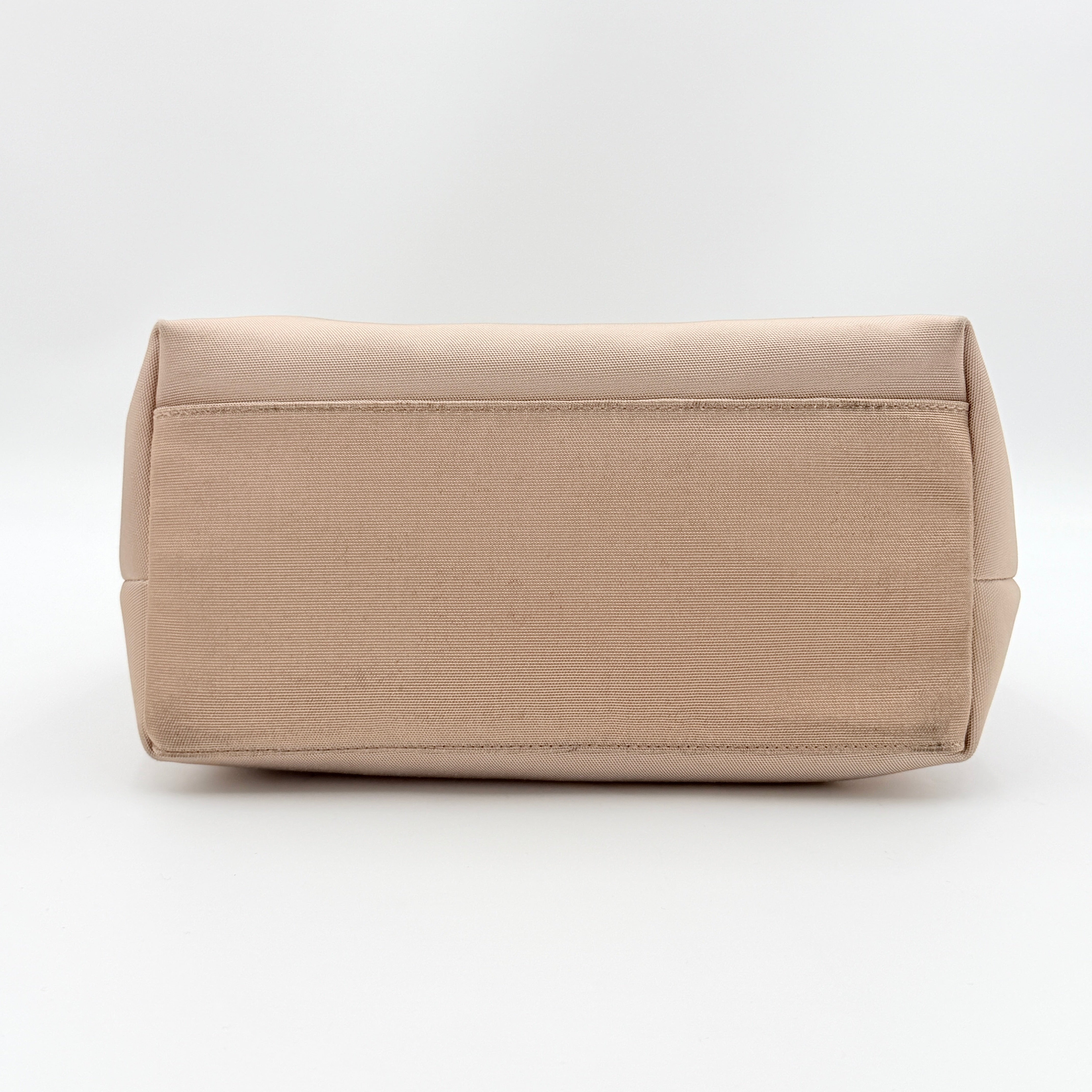 Gucci beige canvas hobo shoulder bag with pink leather accents and silver-tone hardware, displayed front-facing on a white background.