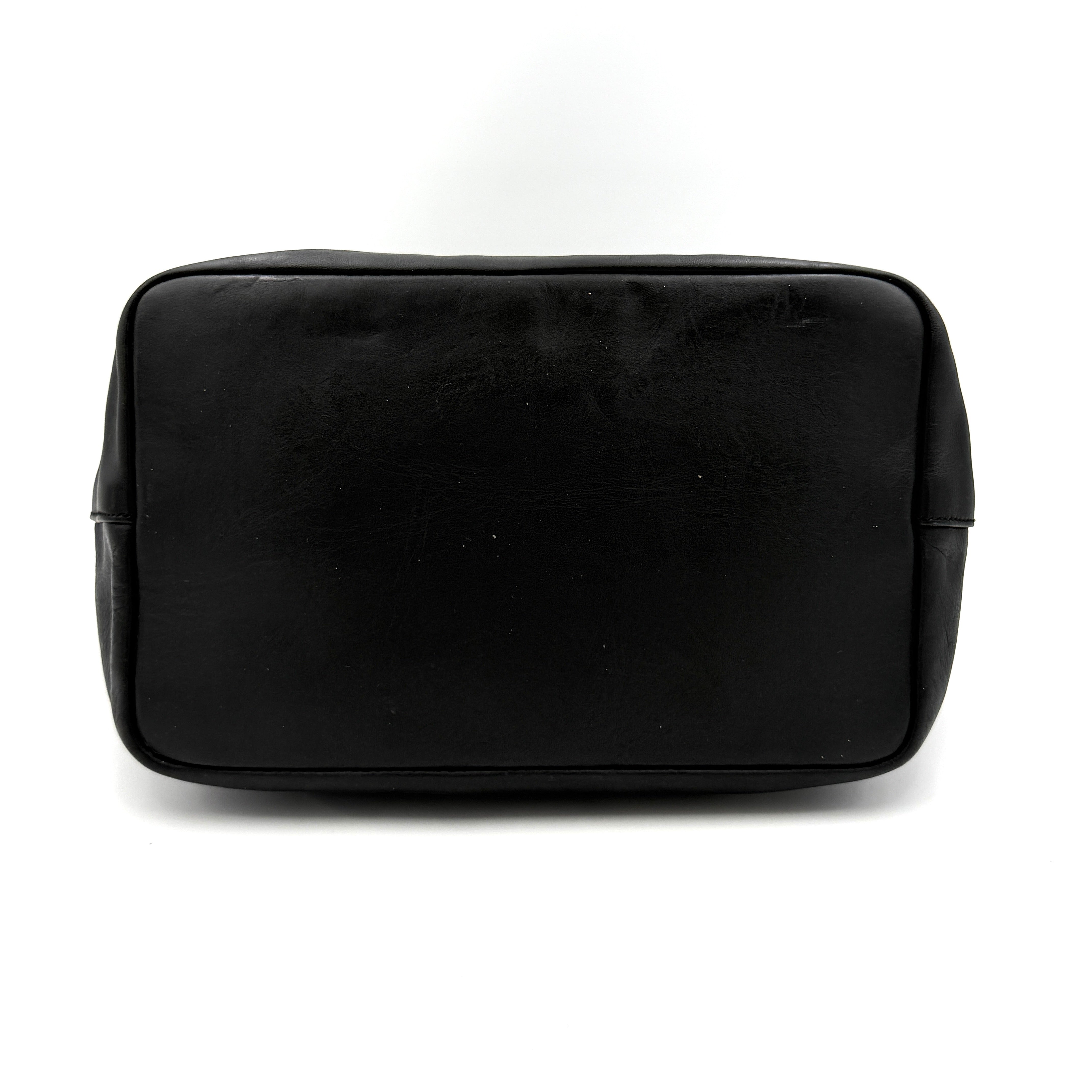 Gucci black leather hobo bag with bamboo handle and silver-tone hardware shown against a white background.