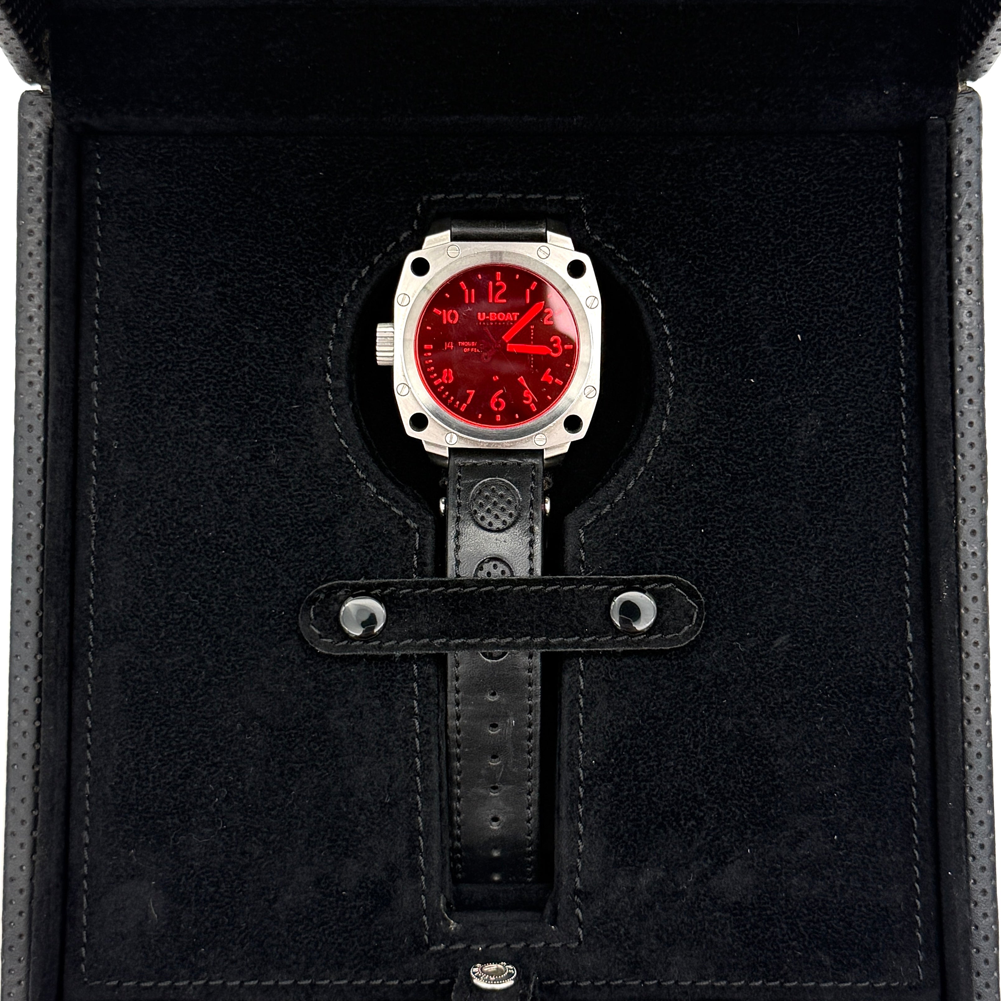 U-Boat Thousands Of Feet stainless steel watch with red dial and black leather strap, displayed on black branded box