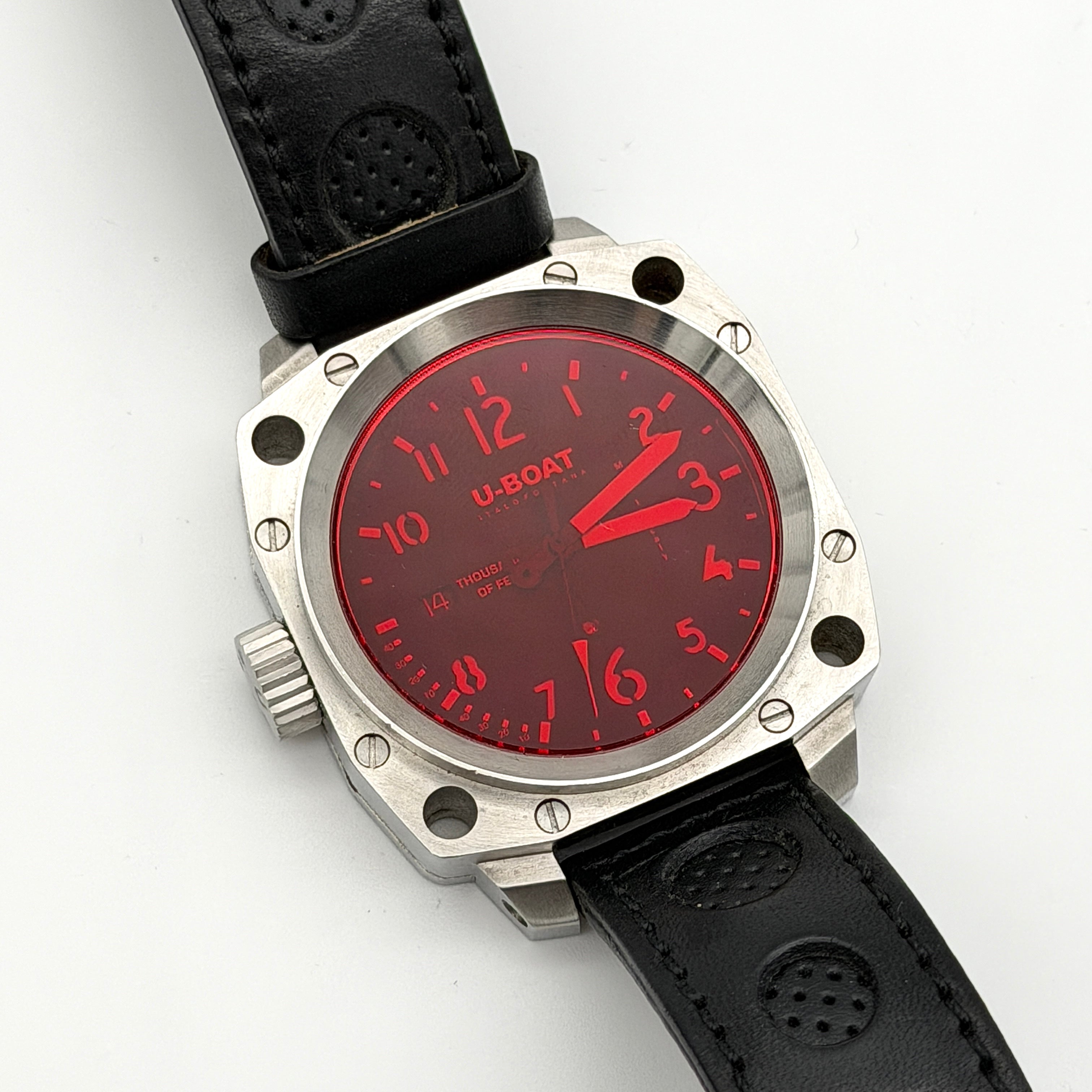 U-Boat Thousands Of Feet stainless steel watch with red dial and black leather strap, displayed on black branded box