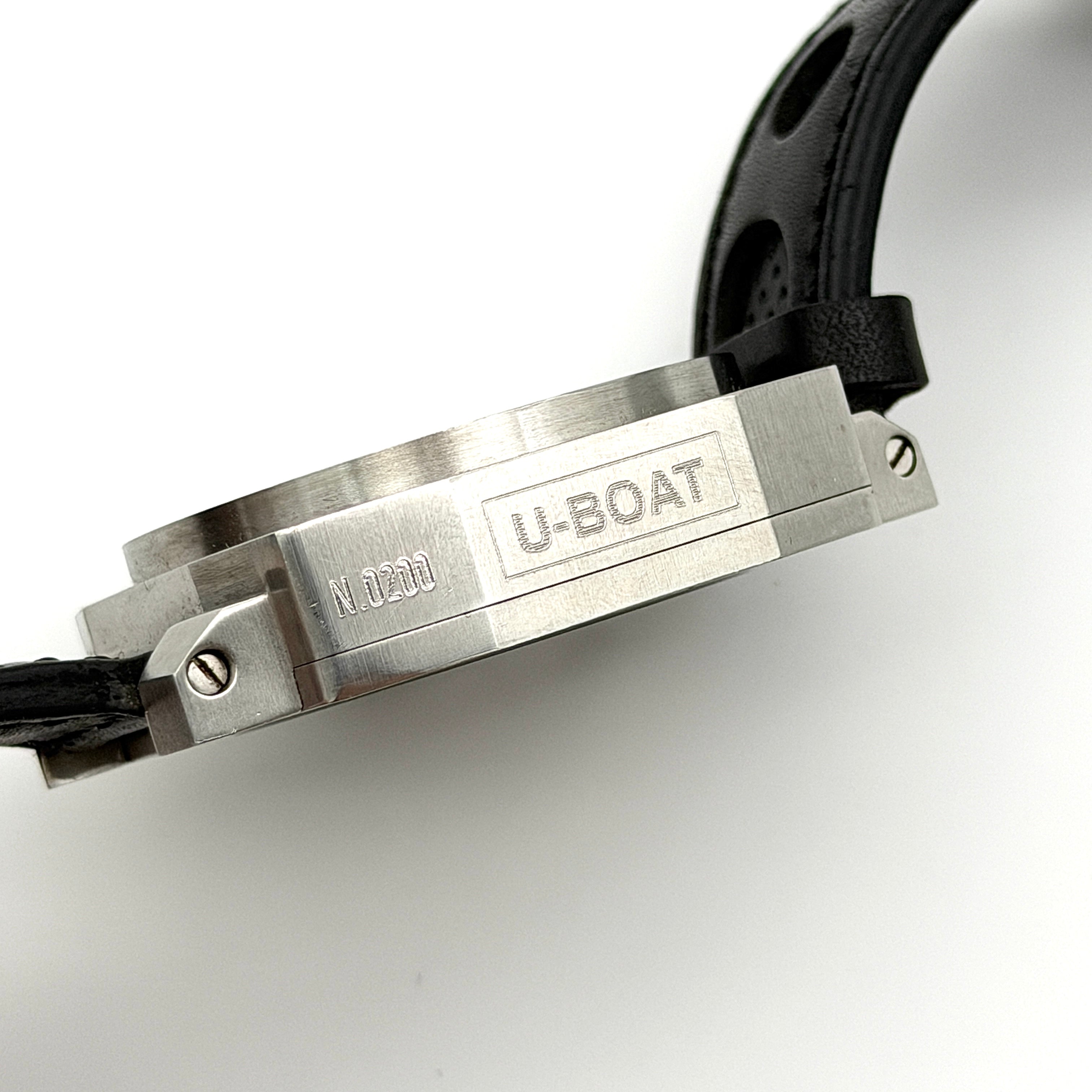 U-Boat Thousands Of Feet stainless steel watch with red dial and black leather strap, displayed on black branded box