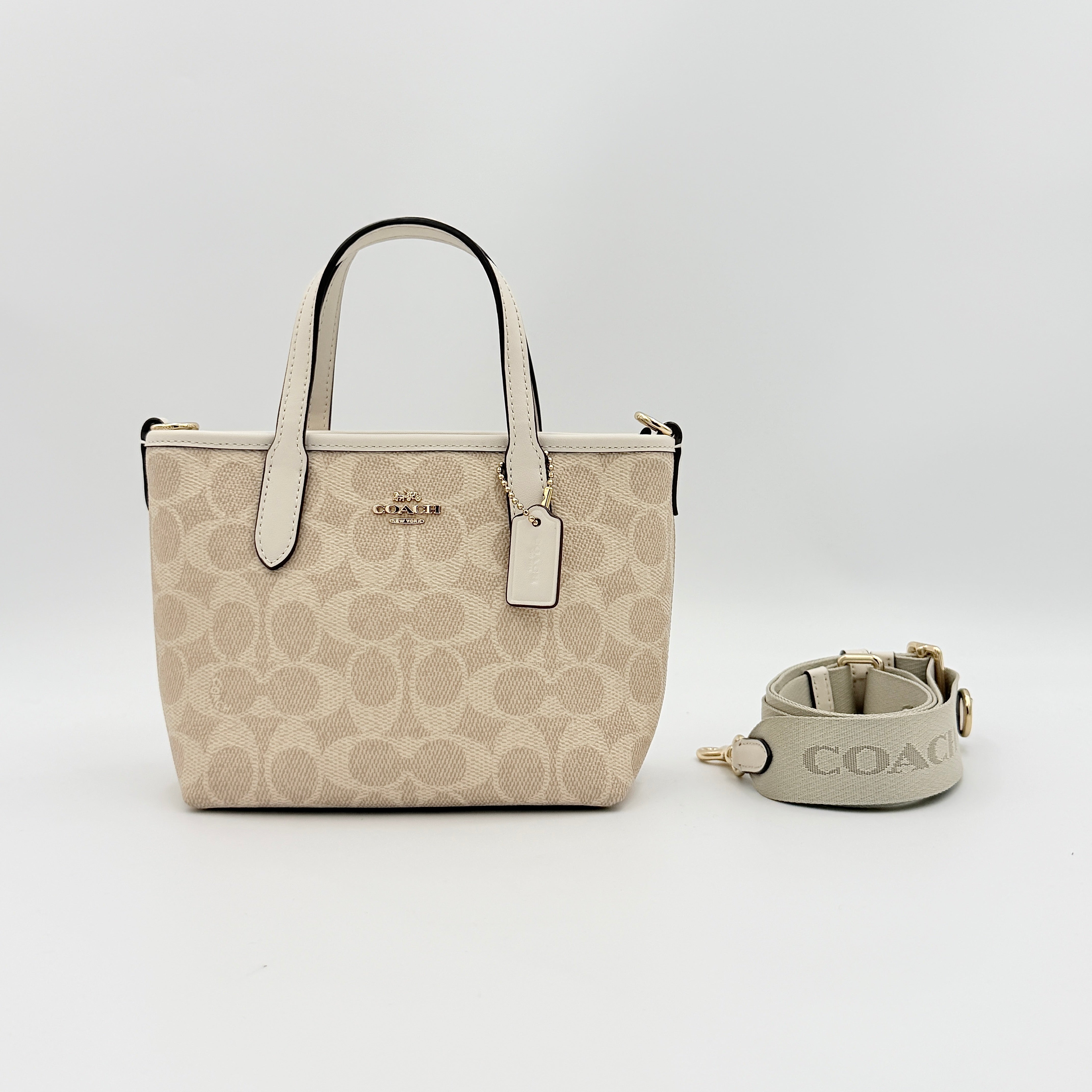 Coach 2Way Mini City Tote in beige and white with signature jacquard, shown with detachable logo canvas strap.