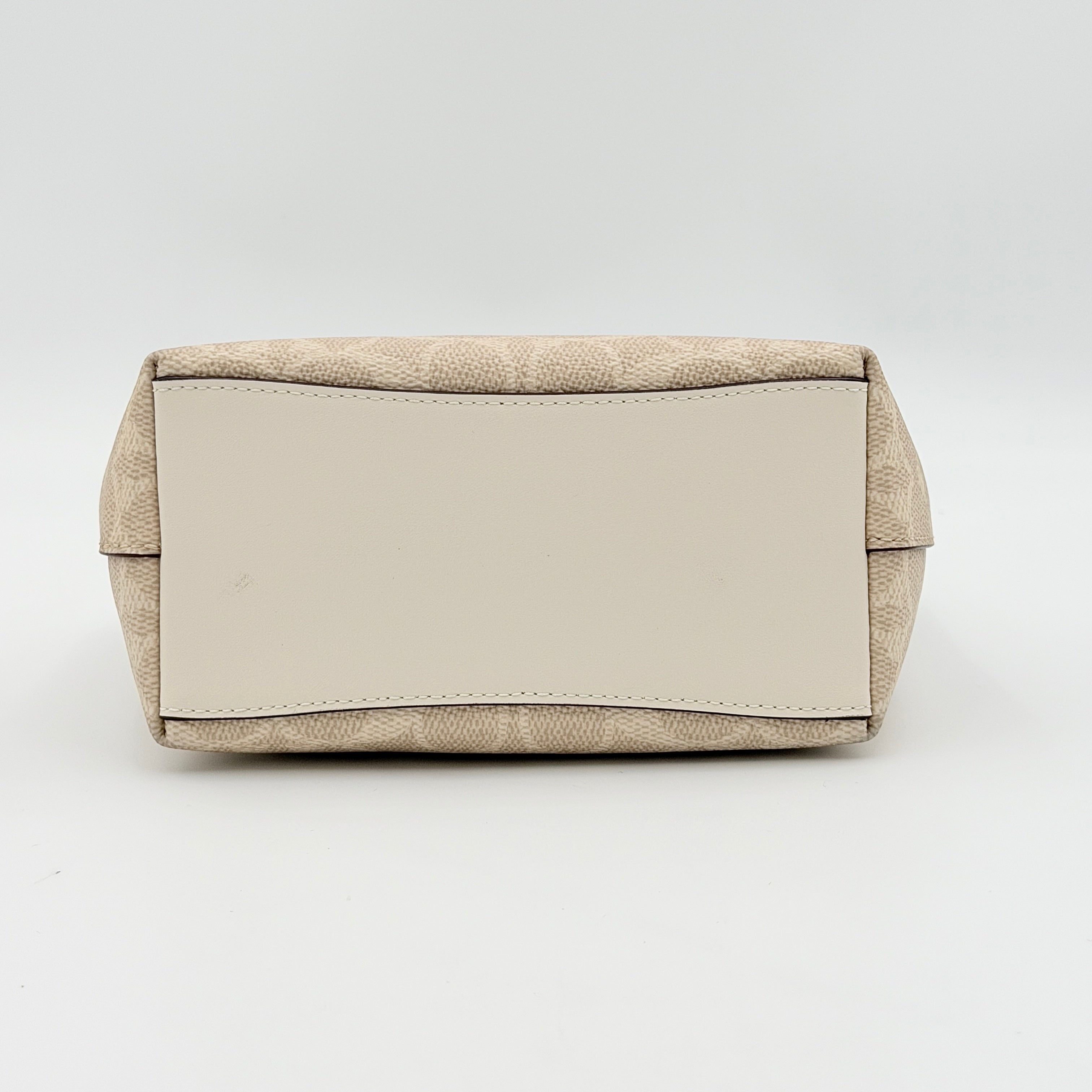 Coach 2Way Mini City Tote in beige and white with signature jacquard, shown with detachable logo canvas strap.