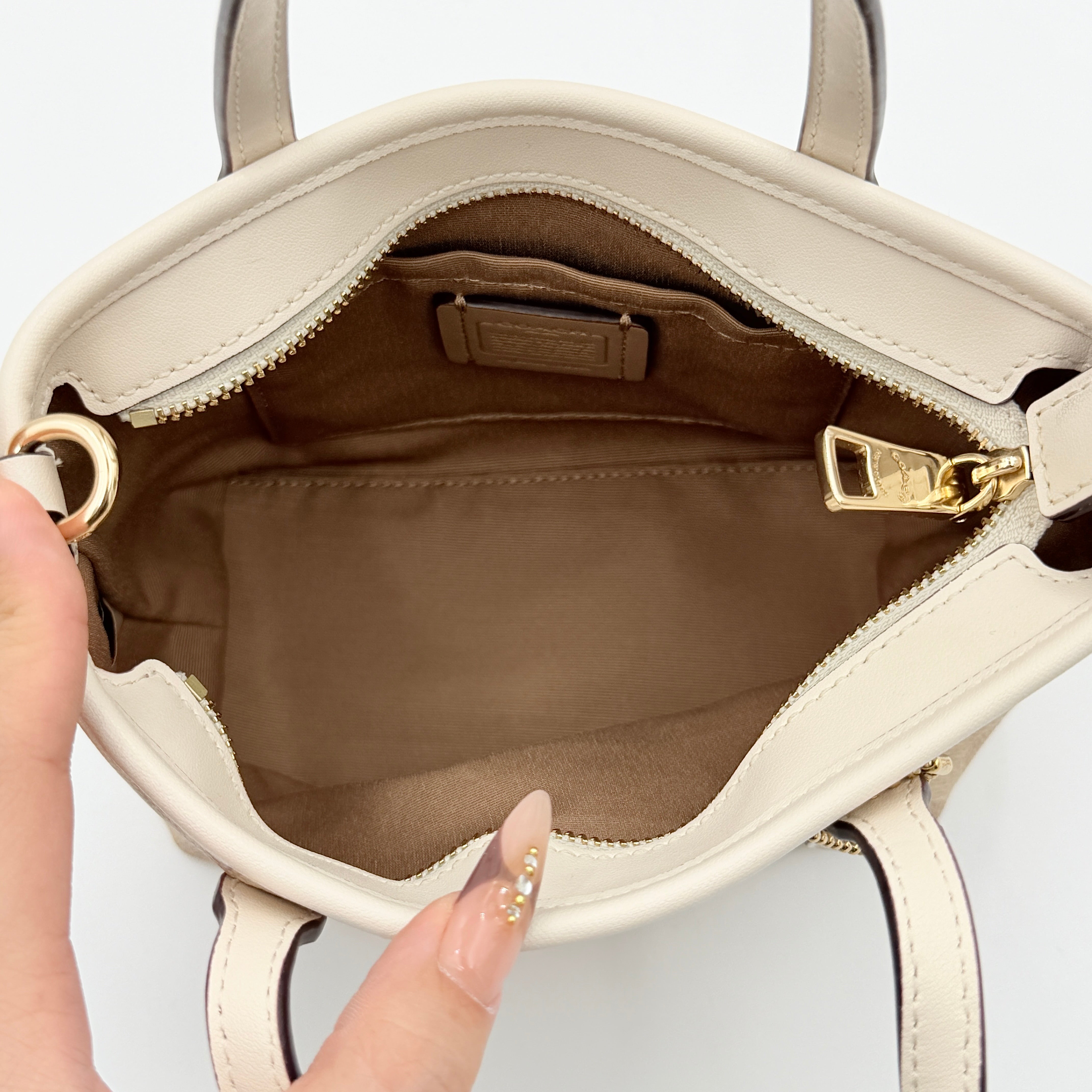 Coach 2Way Mini City Tote in beige and white with signature jacquard, shown with detachable logo canvas strap.