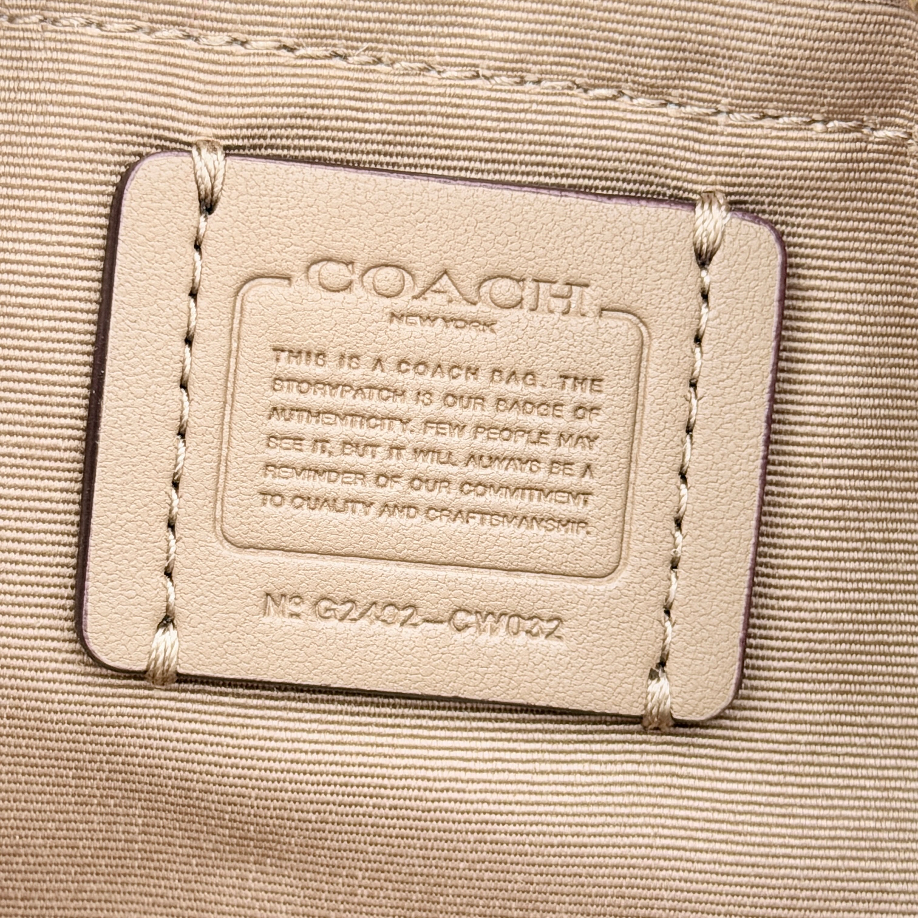 Coach 2Way Mini City Tote in beige and white with signature jacquard, shown with detachable logo canvas strap.