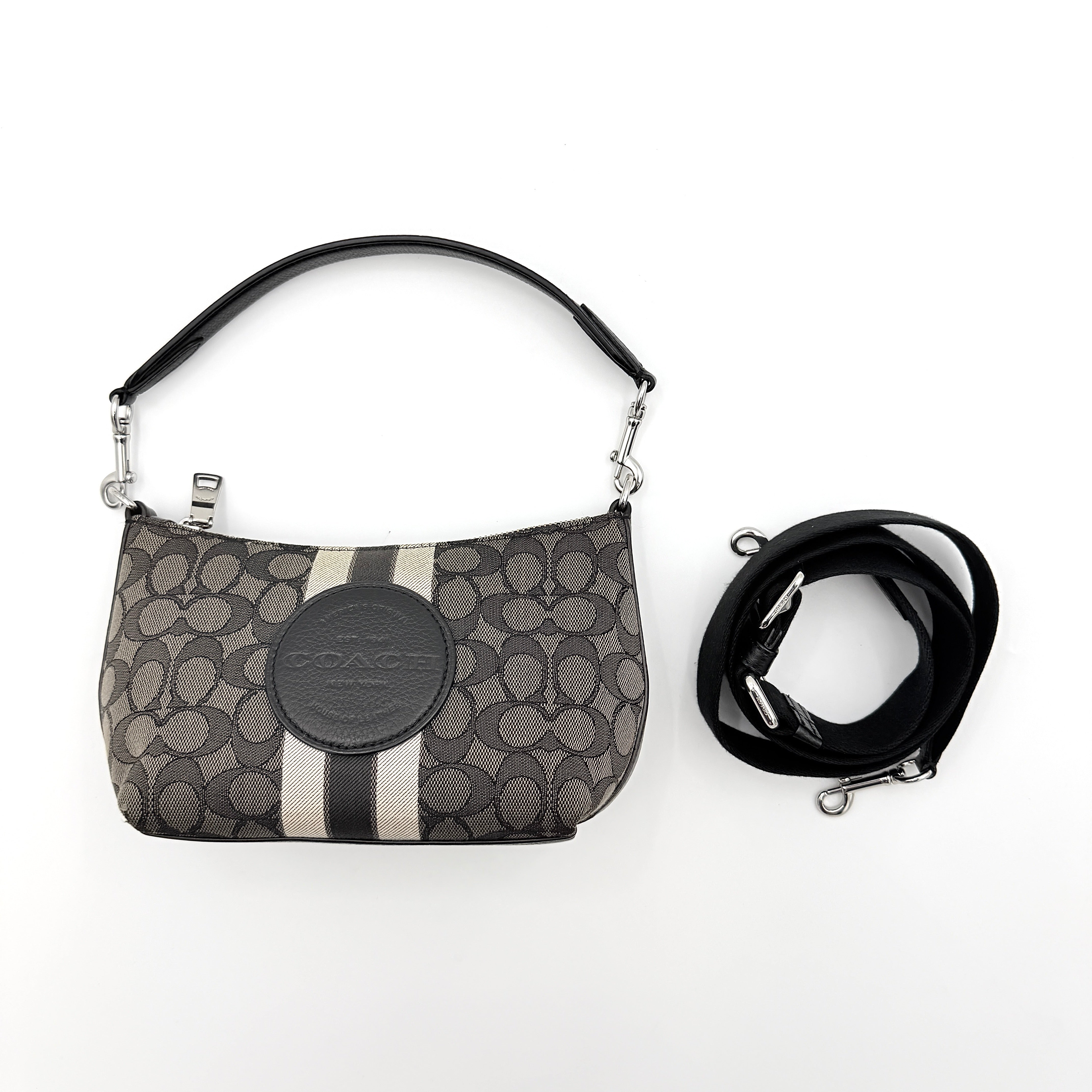 The Coach 2Way Signature Dempsey Stripe Shoulder Bag in black and grey canvas with detachable straps, shown flat on a white background.