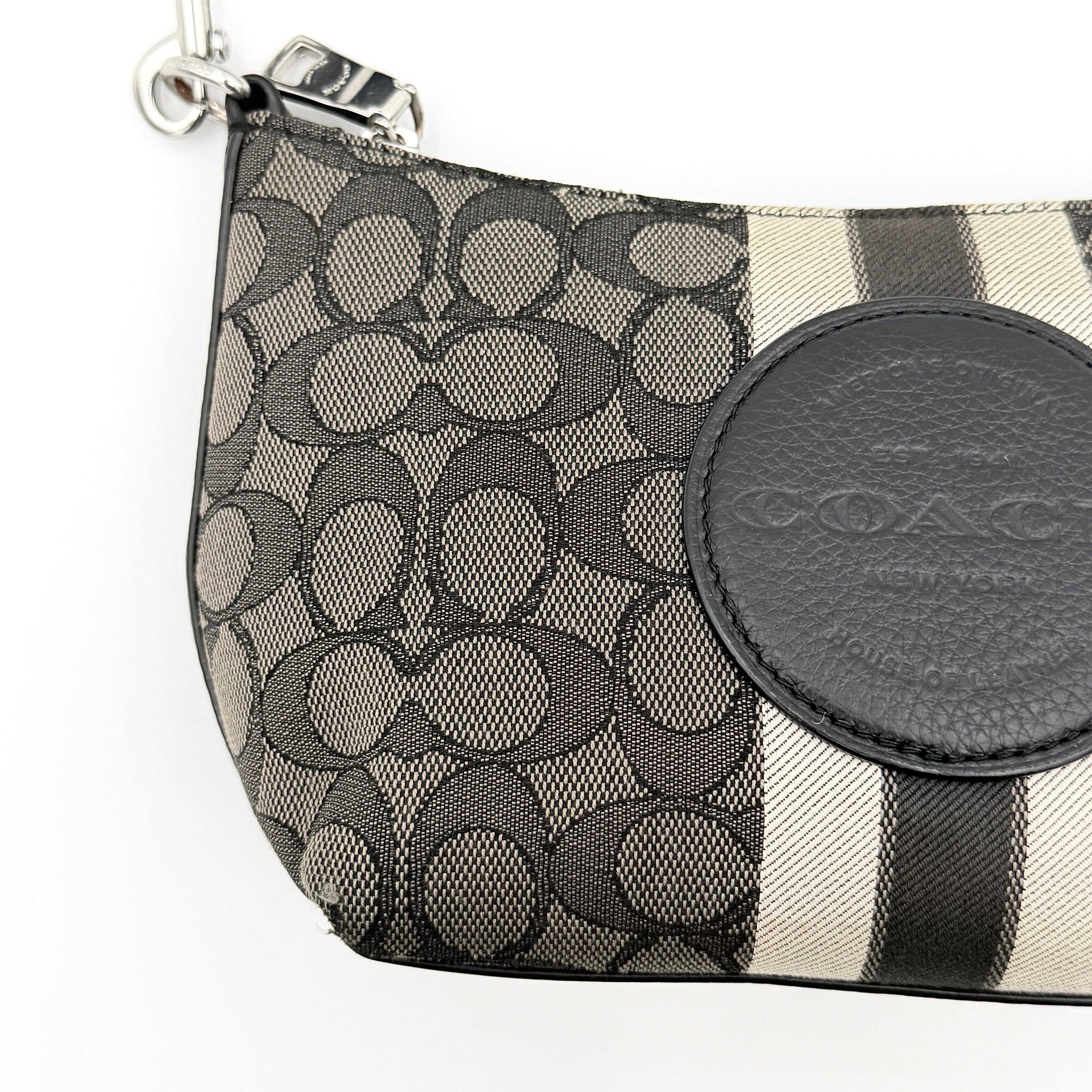 The Coach 2Way Signature Dempsey Stripe Shoulder Bag in black and grey canvas with detachable straps, shown flat on a white background.