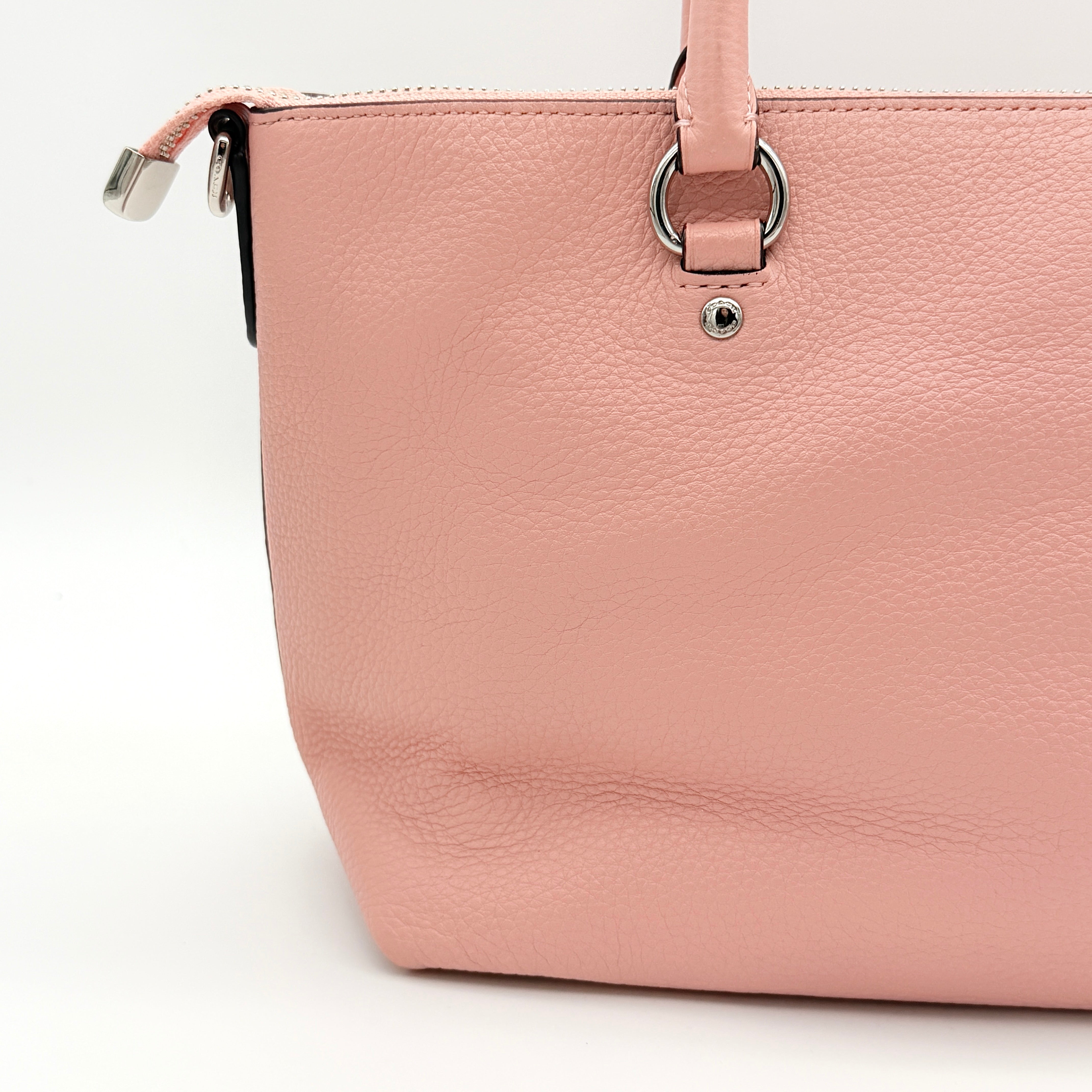 Coach Mini Emma Satchel in pink pebbled leather with silver-tone hardware, shown with detachable strap.