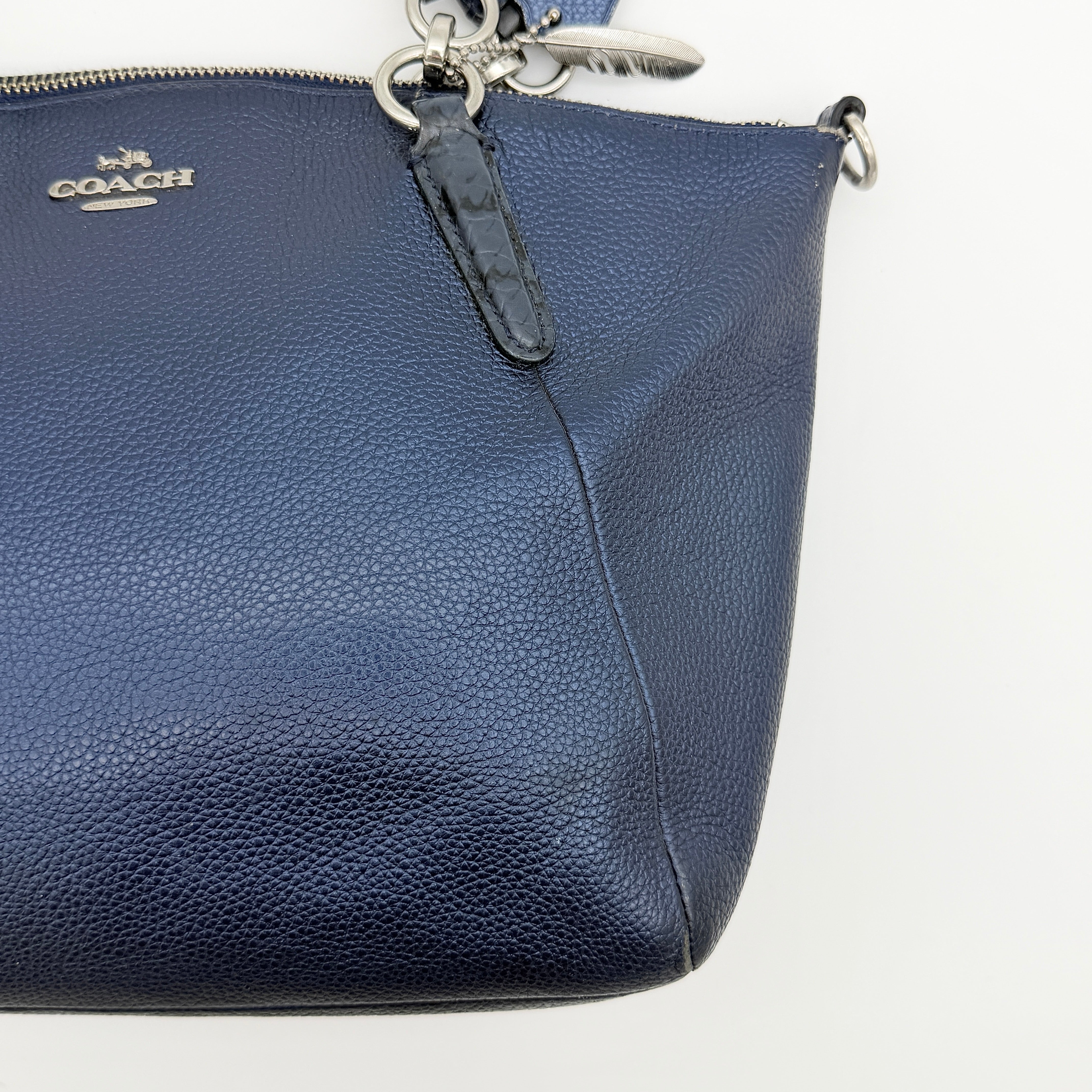 Coach Kelsey 2Way shoulder bag in navy blue pebble leather with silver-tone hardware, shown with detachable strap.