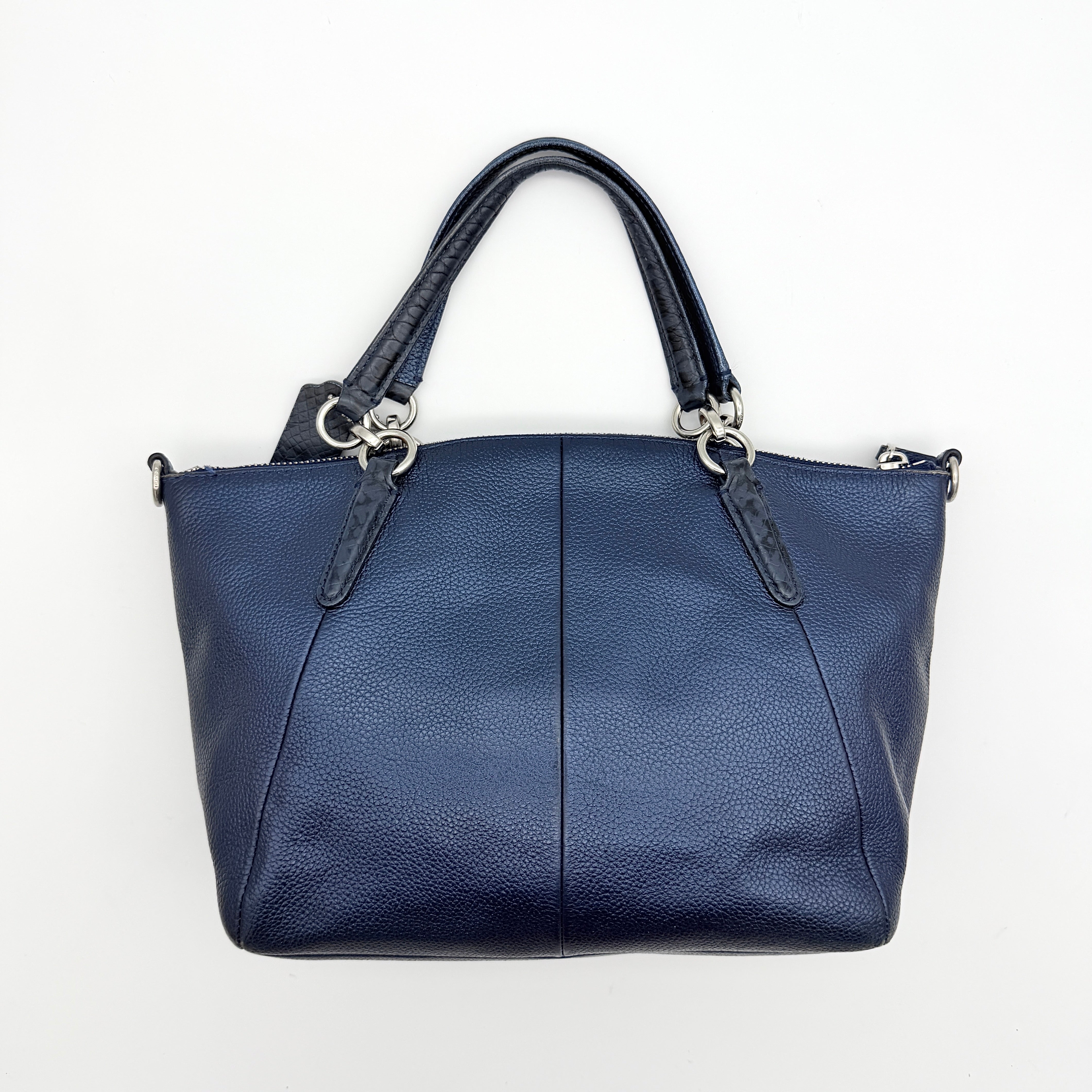 Coach Kelsey 2Way shoulder bag in navy blue pebble leather with silver-tone hardware, shown with detachable strap.