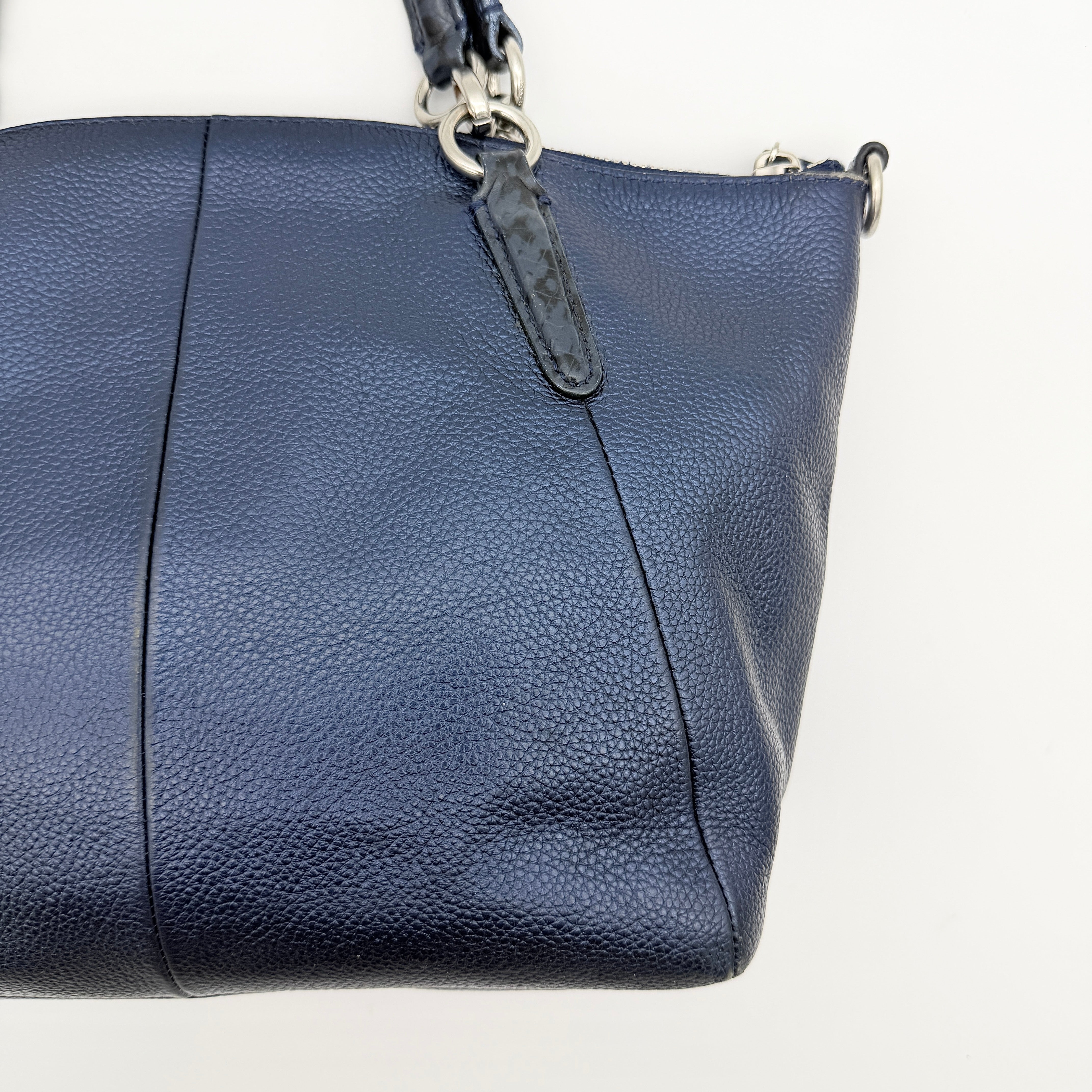 Coach Kelsey 2Way shoulder bag in navy blue pebble leather with silver-tone hardware, shown with detachable strap.
