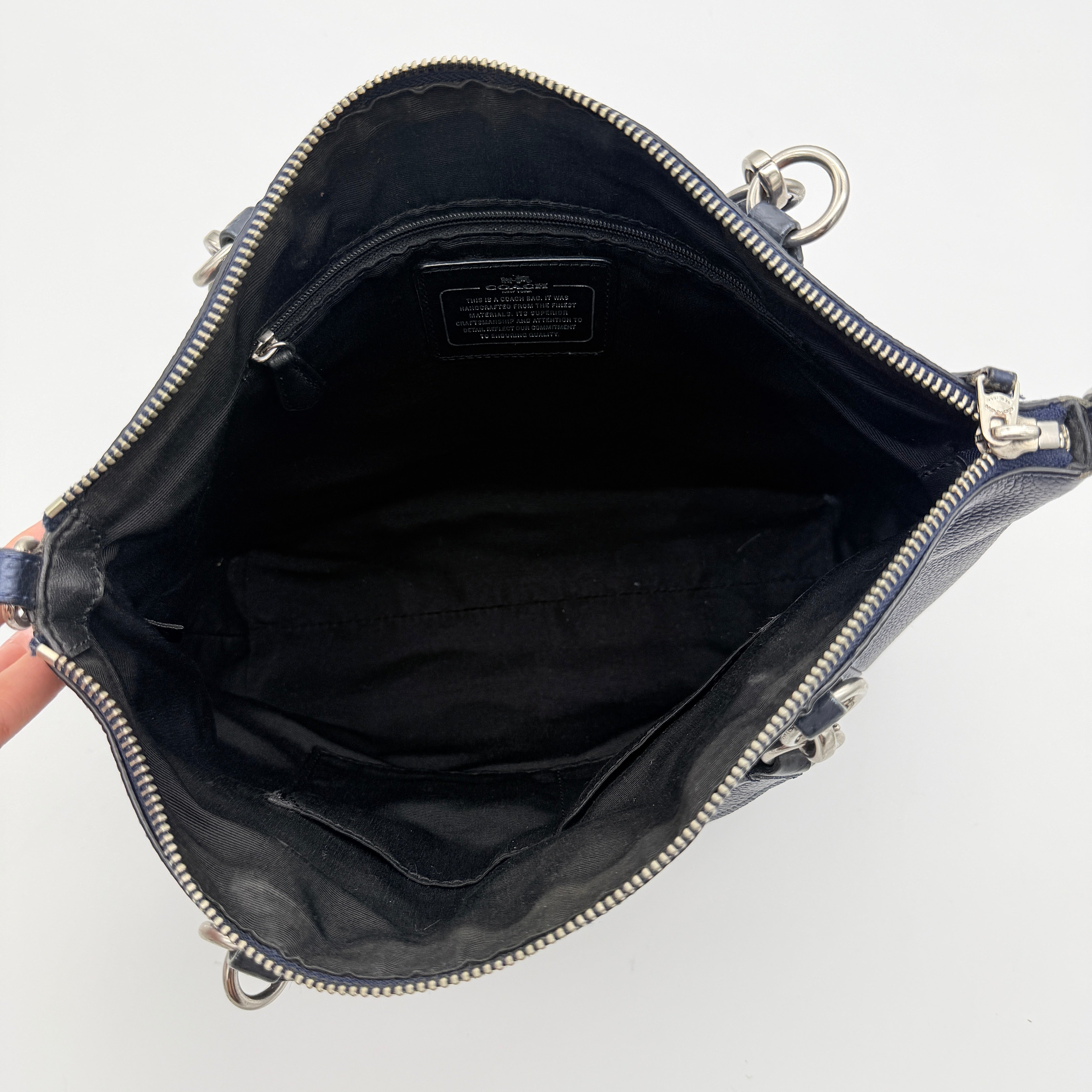 Coach Kelsey 2Way shoulder bag in navy blue pebble leather with silver-tone hardware, shown with detachable strap.