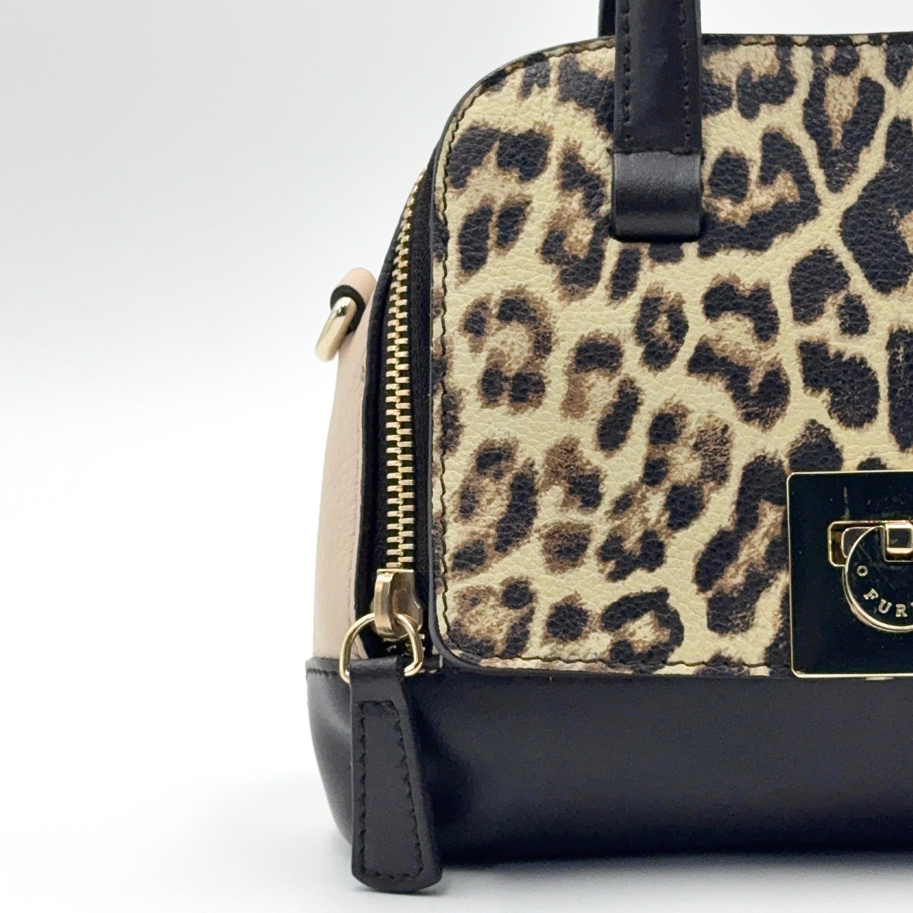 Furla 2Way Leopard Shoulder Bag in black leather with top handles, leopard print front, and detachable strap displayed beside it.