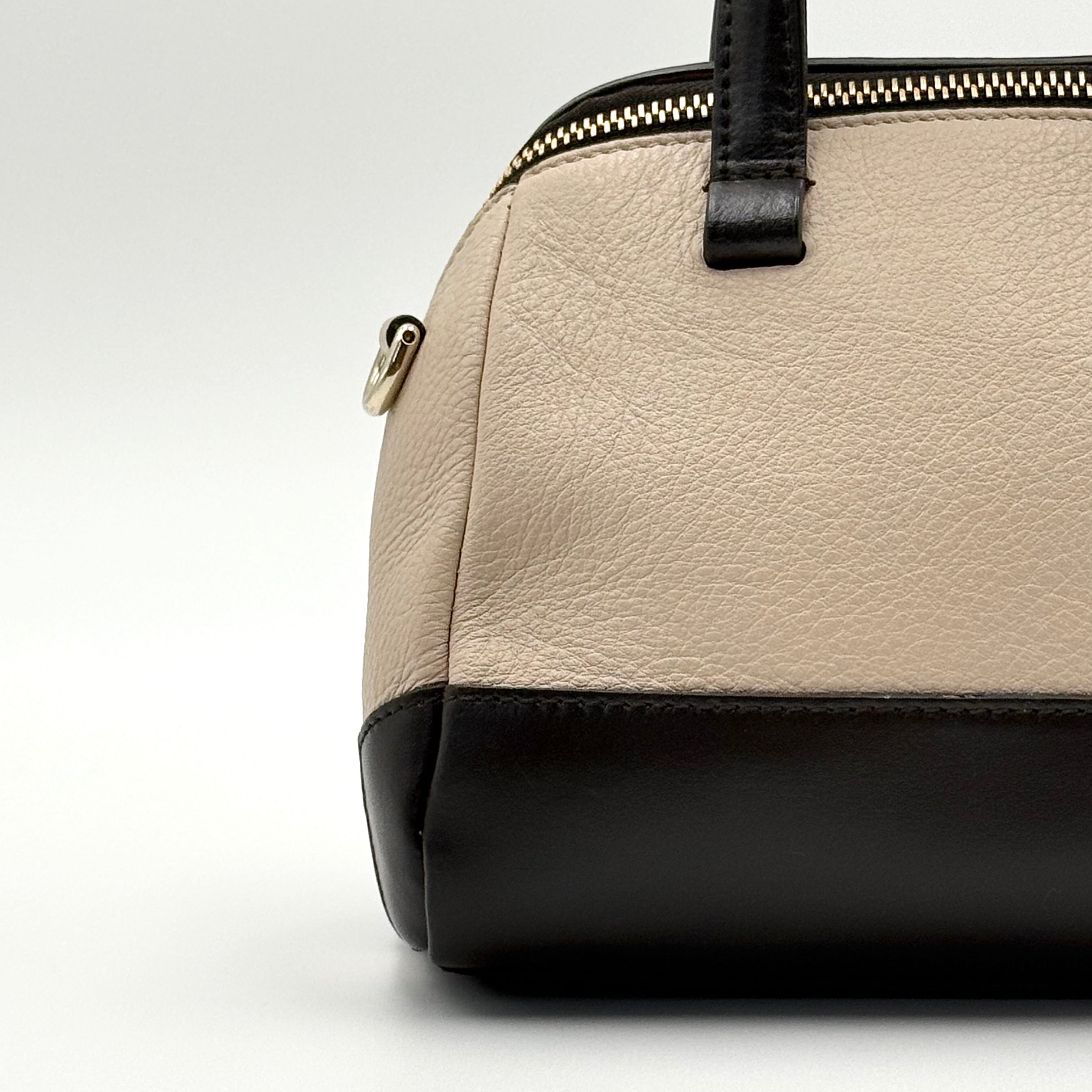 Furla 2Way Leopard Shoulder Bag in black leather with top handles, leopard print front, and detachable strap displayed beside it.