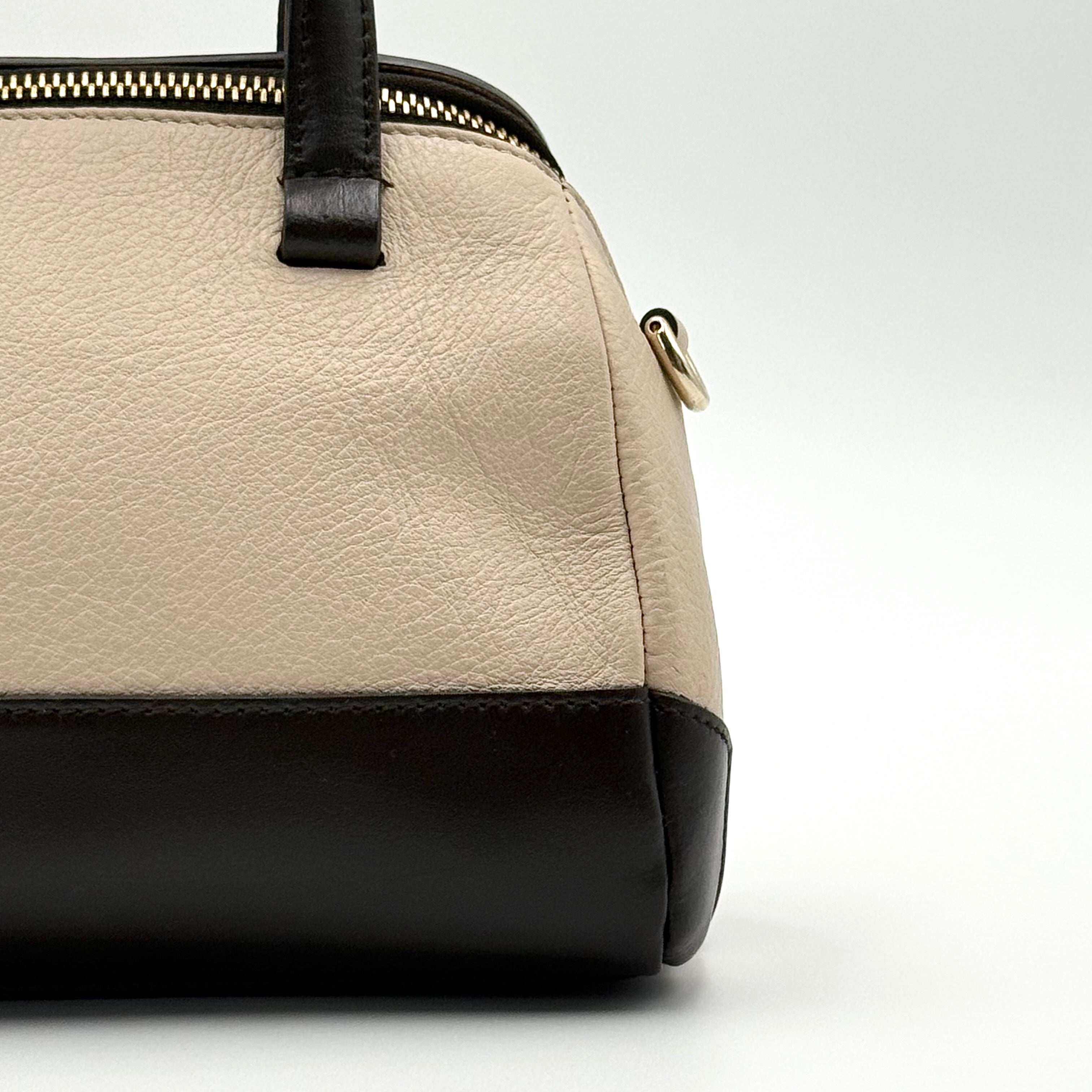 Furla 2Way Leopard Shoulder Bag in black leather with top handles, leopard print front, and detachable strap displayed beside it.