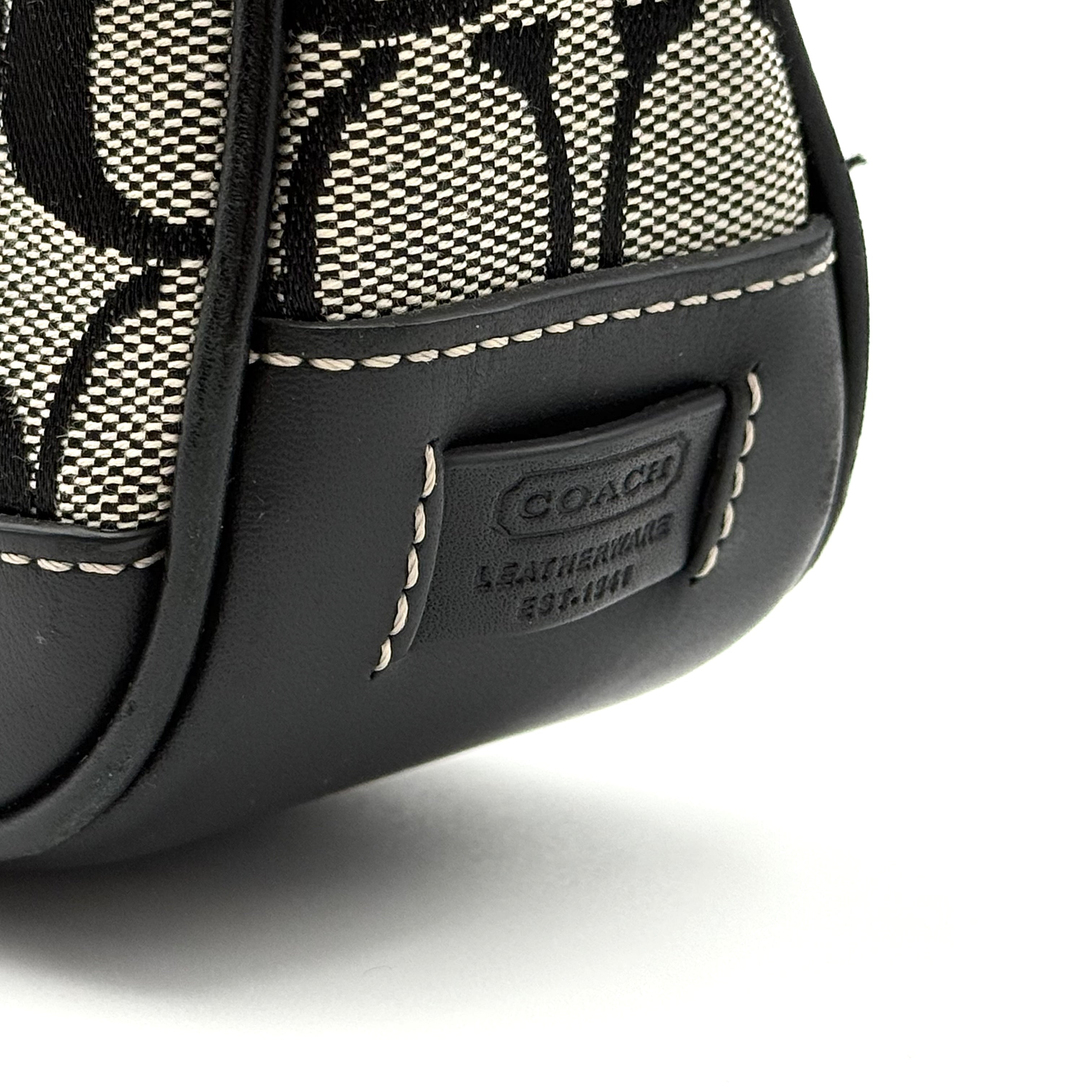 Coach Y2K Demi Shoulder Bag in black and grey signature jacquard with black leather trim and detachable Coach tag.