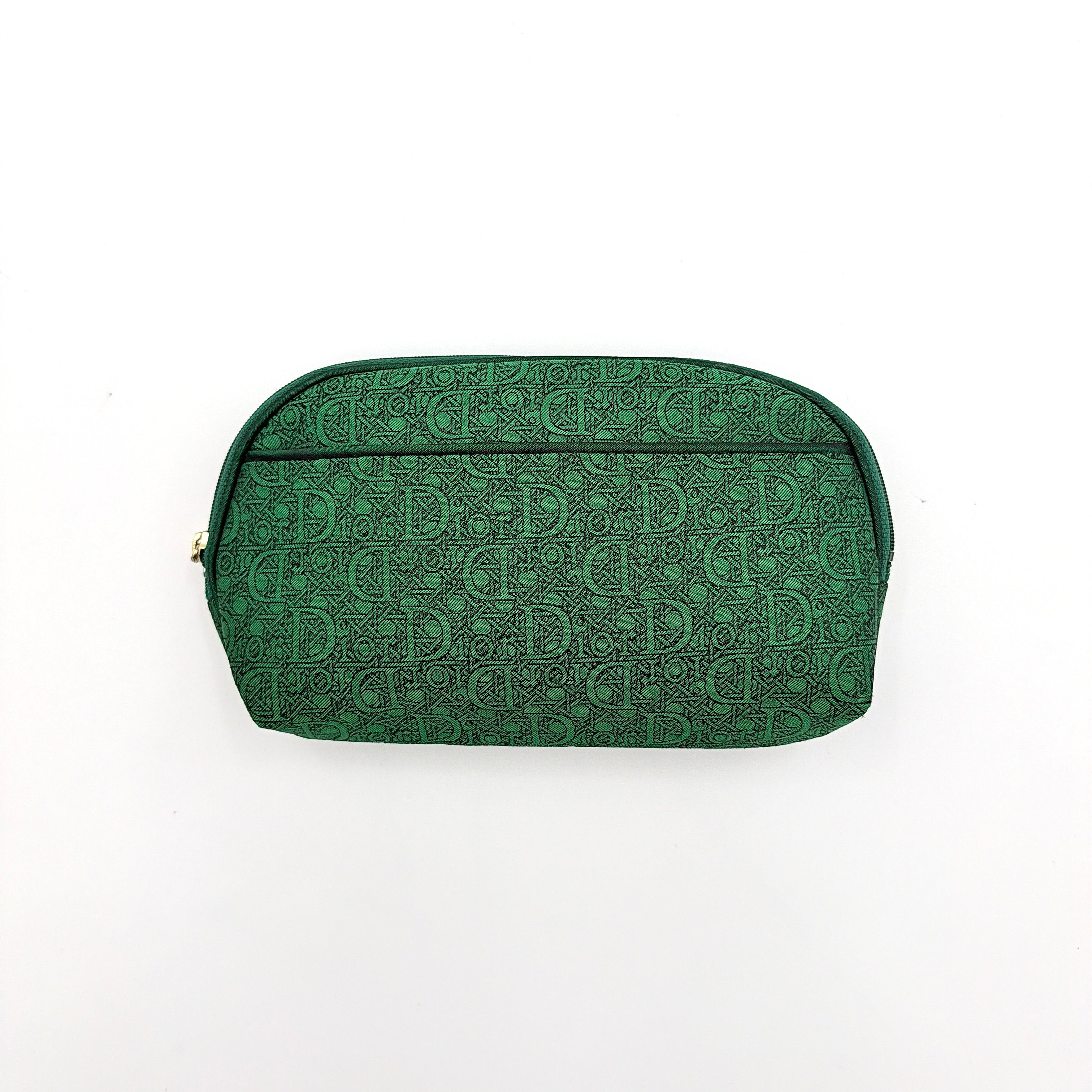 Green Christian Dior Oblique cosmetic pouch with monogram canvas and gold-tone zip, shown from the front.