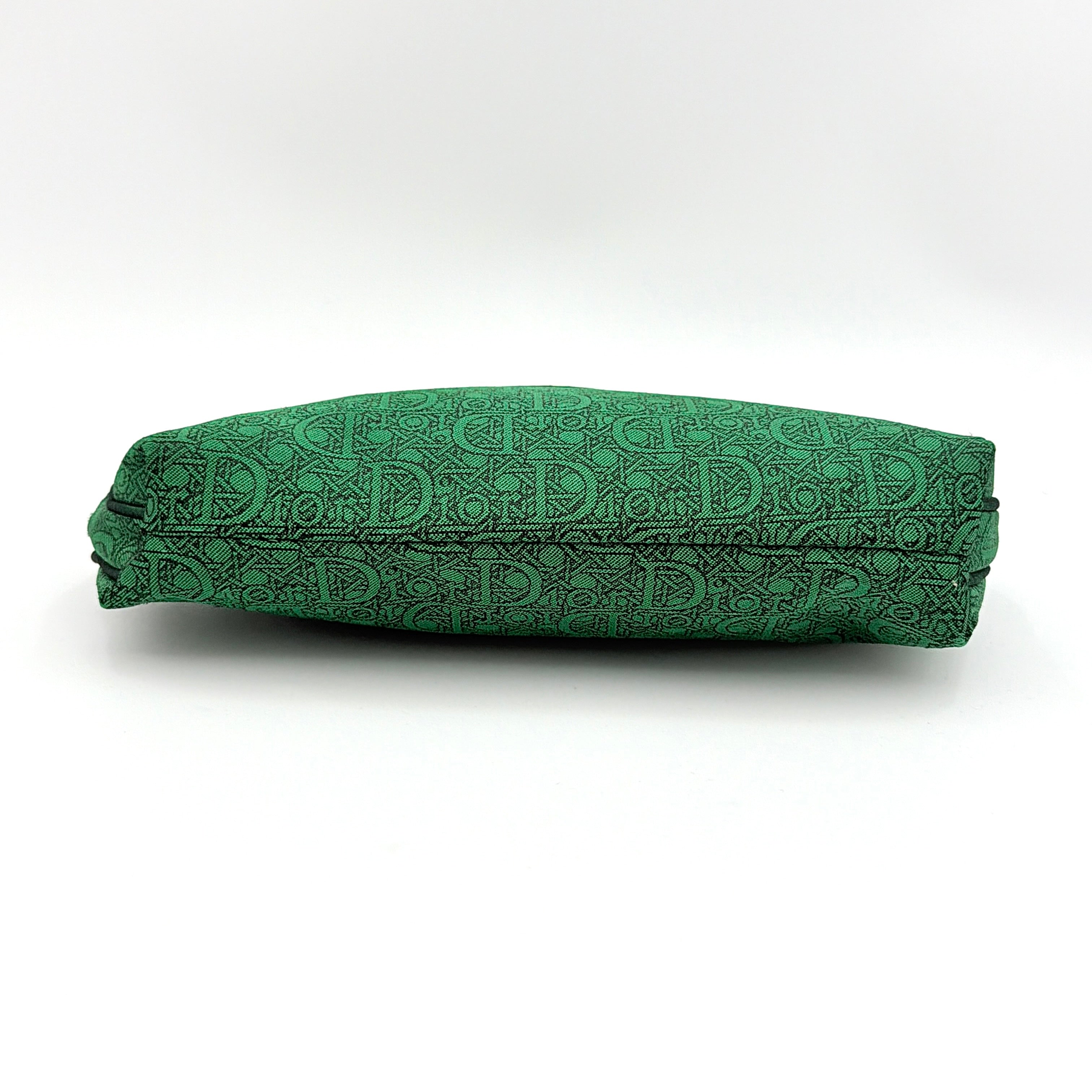 Green Christian Dior Oblique cosmetic pouch with monogram canvas and gold-tone zip, shown from the front.