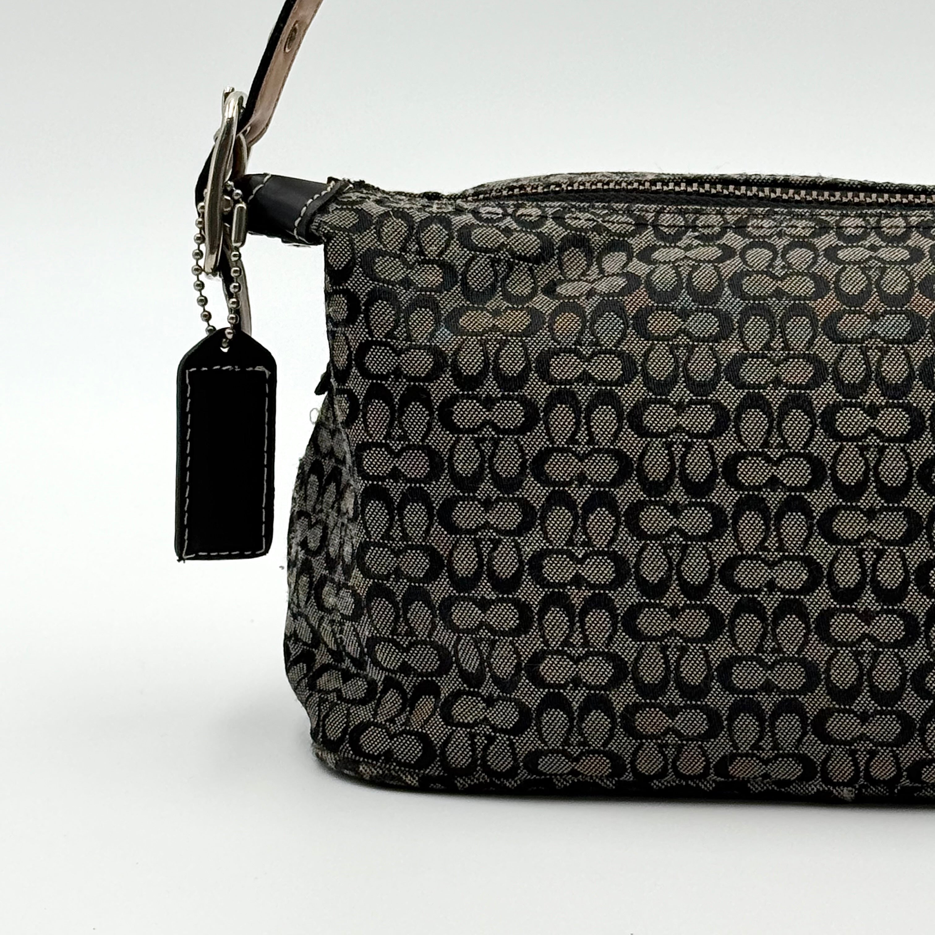 Coach Signature Hobo Shoulder Bag in grey and black canvas with leather trim and silver hardware, shown with monogram detail.