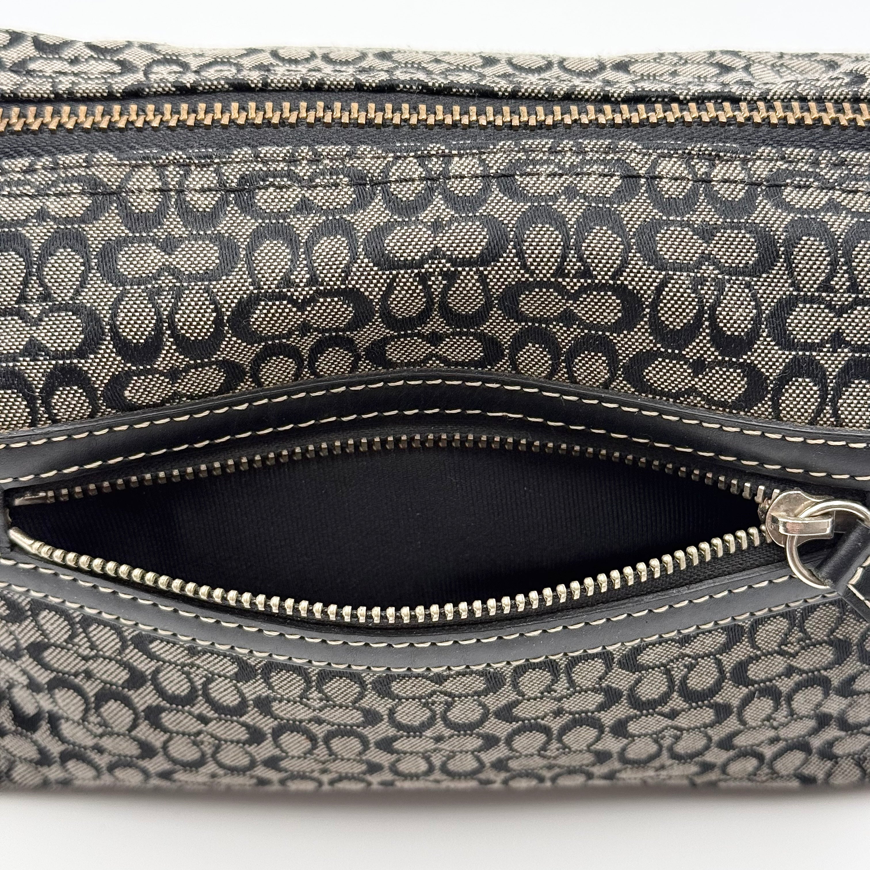 Coach Signature Hobo Shoulder Bag in grey and black canvas with leather trim and silver hardware, shown with monogram detail.