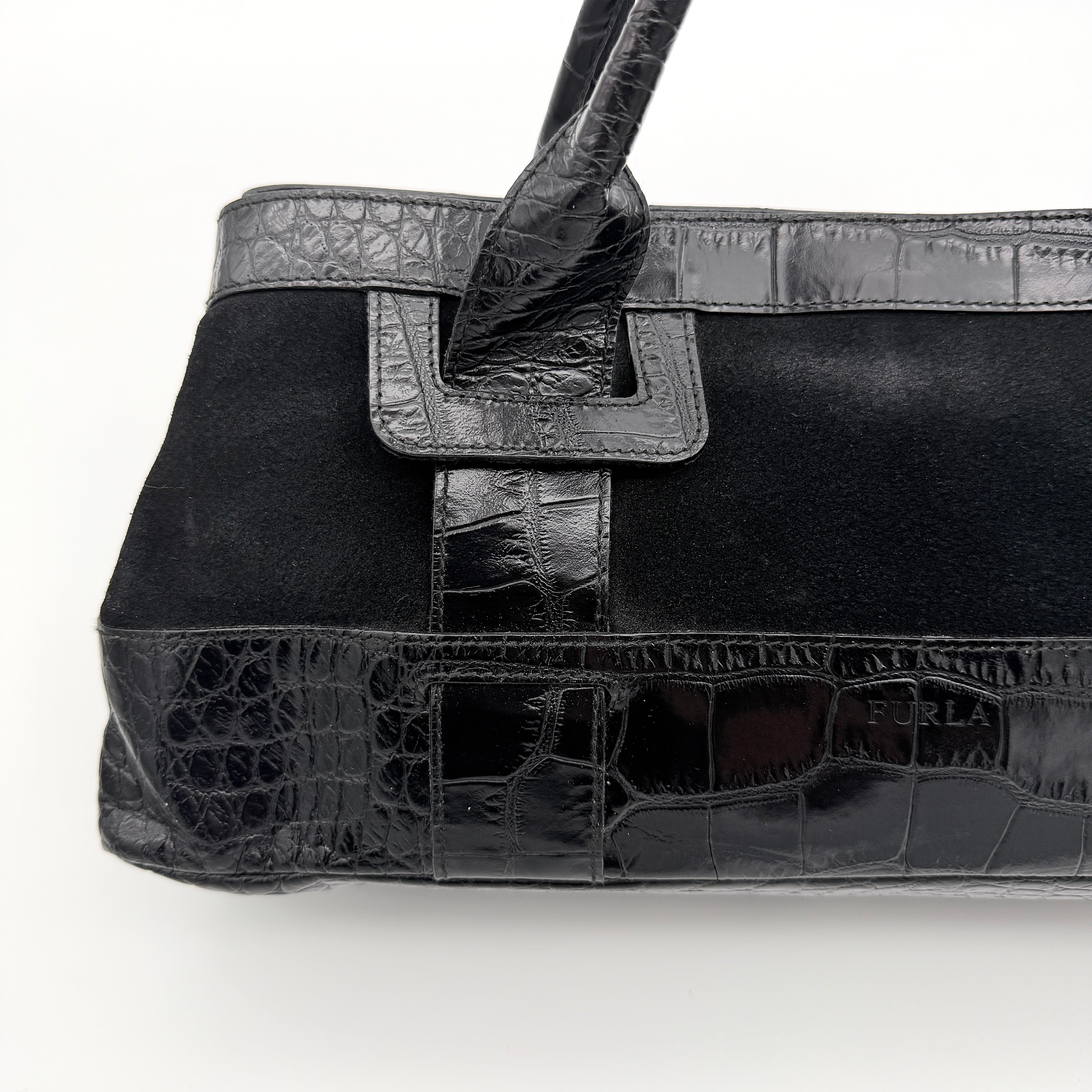 Furla croc-embossed black leather shoulder bag with suede panels and double handles, displayed against a white background.