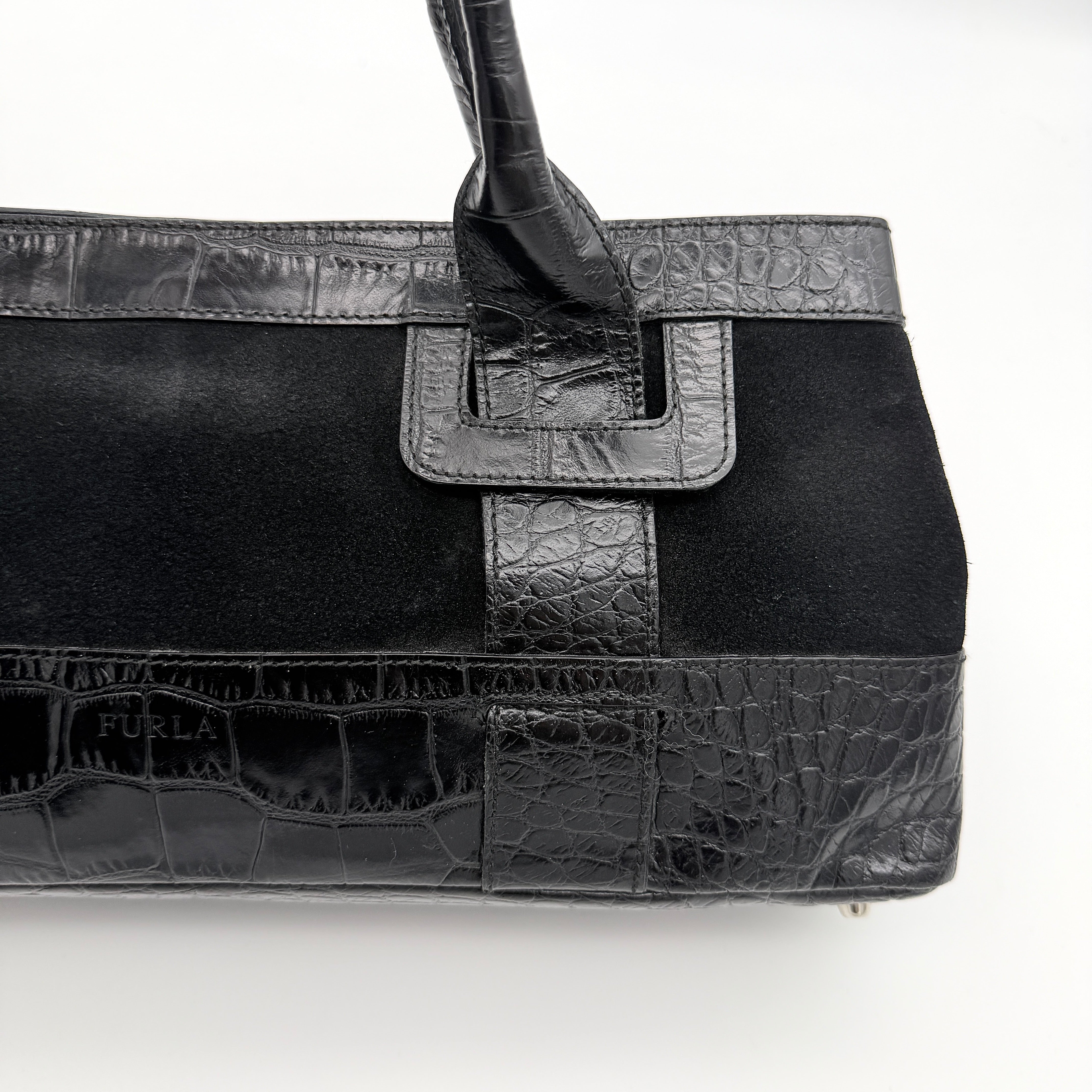 Furla croc-embossed black leather shoulder bag with suede panels and double handles, displayed against a white background.