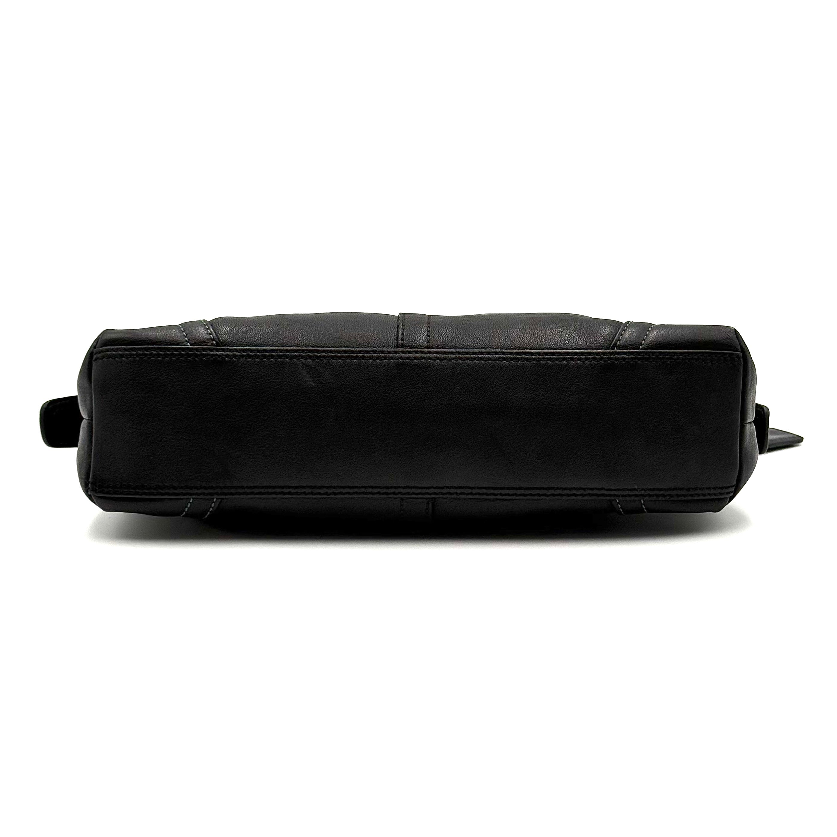 Coach Hampton Demi Baguette shoulder bag in smooth black leather with a curved top handle and silver-tone hardware.