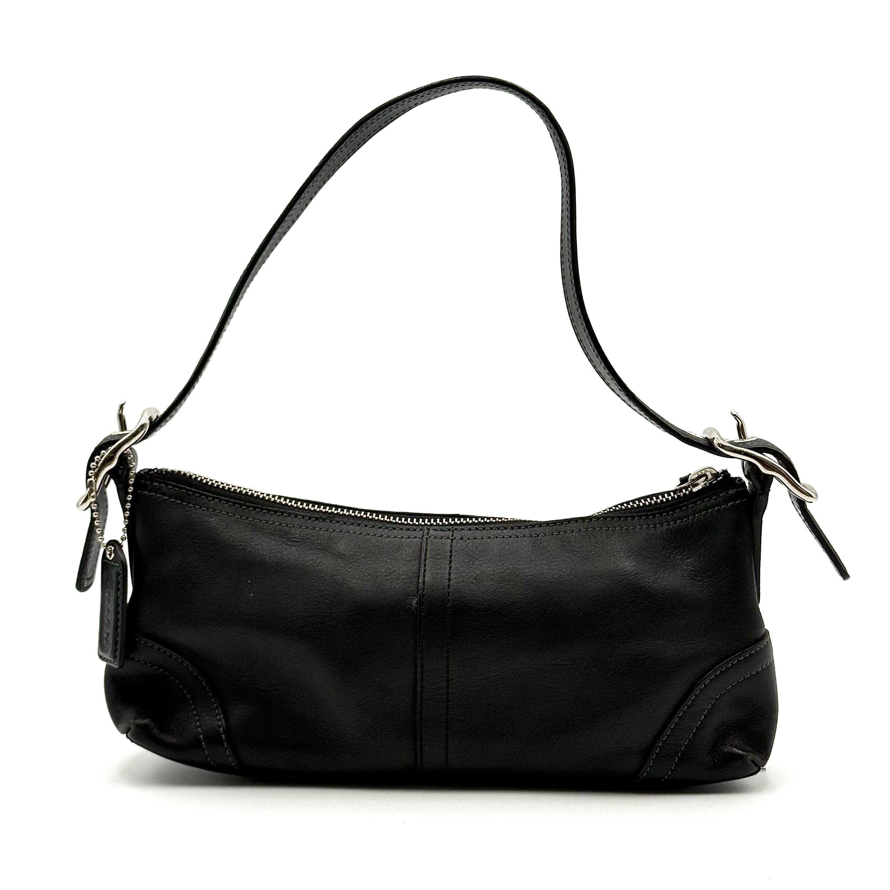 Coach Hampton Demi Baguette shoulder bag in smooth black leather with a curved top handle and silver-tone hardware.
