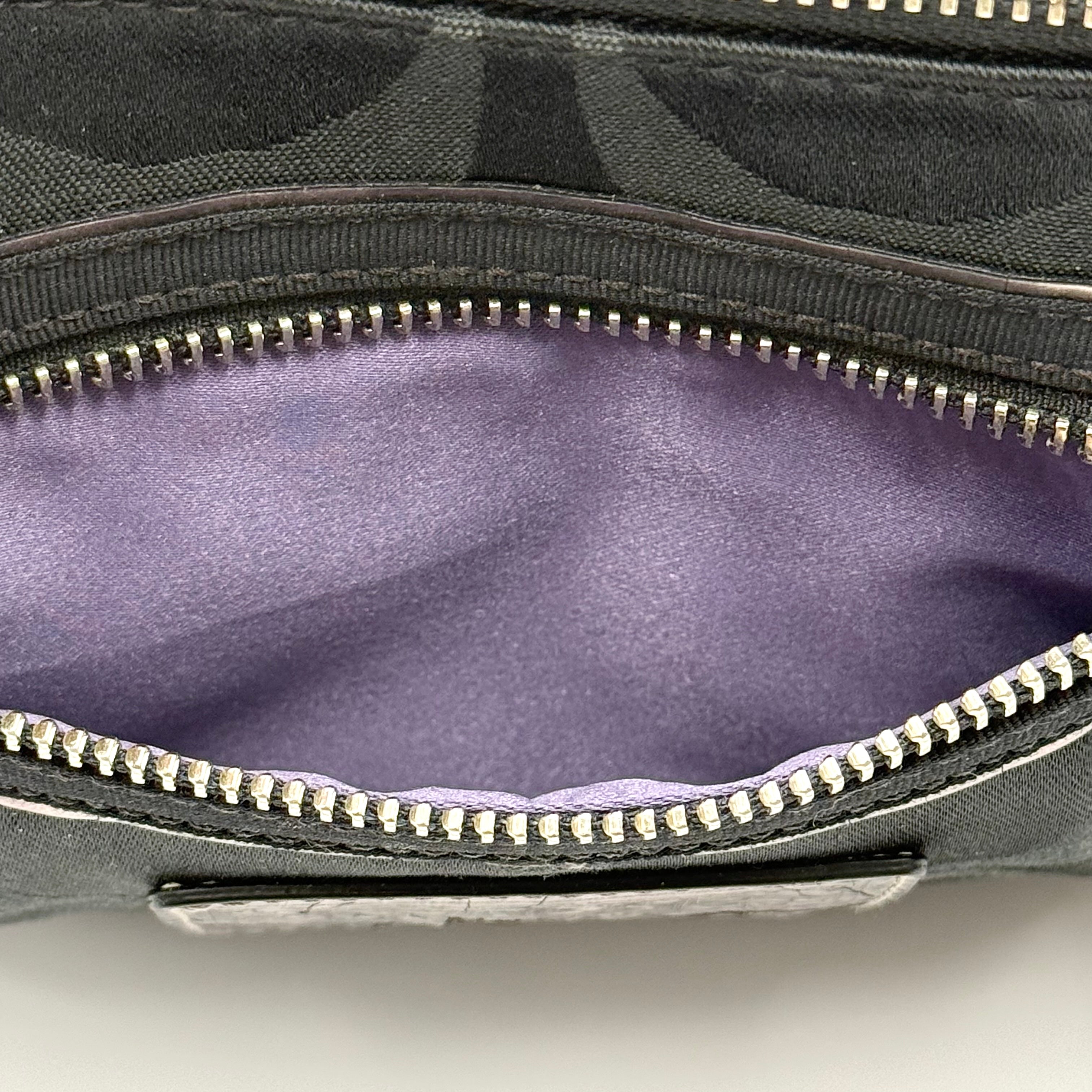 Coach black Signature Poppy Shoulder Bag with silver hardware, Coach tags, and tonal jacquard finish on a white background.
