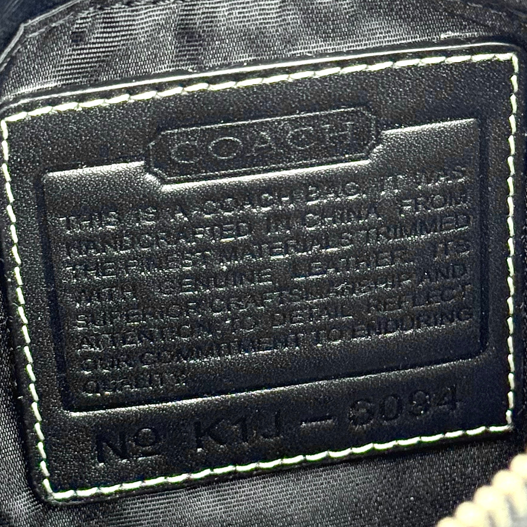 Coach Y2K Demi Shoulder Bag in black and grey signature jacquard with black leather trim and silver hardware.