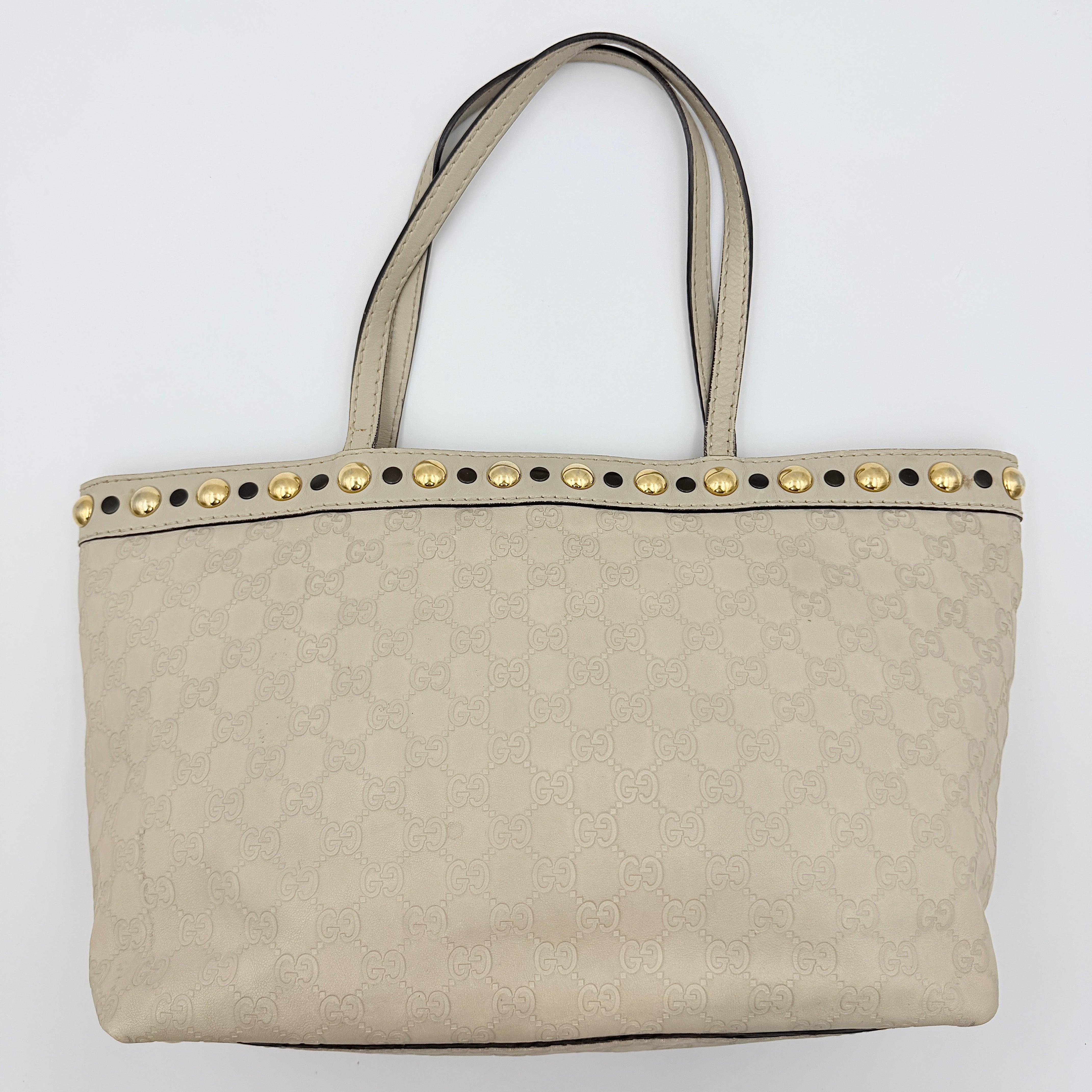 Gucci GG Monogram Babouska shoulder bag in cream canvas with gold-tone stud details and double top handles.