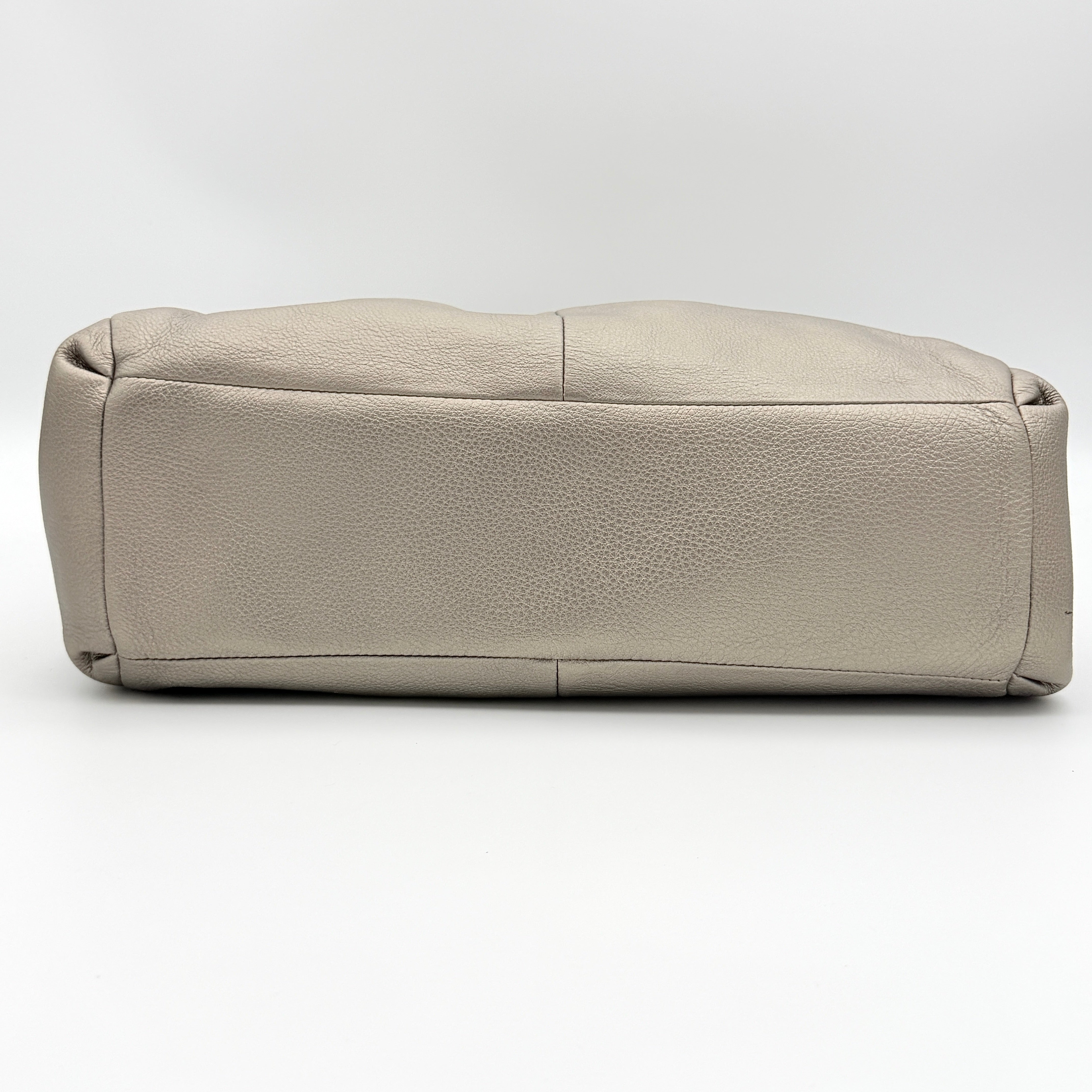 Coach Madison Phoebe shoulder bag in metallic taupe pebbled leather with dual straps and gold-tone hardware.