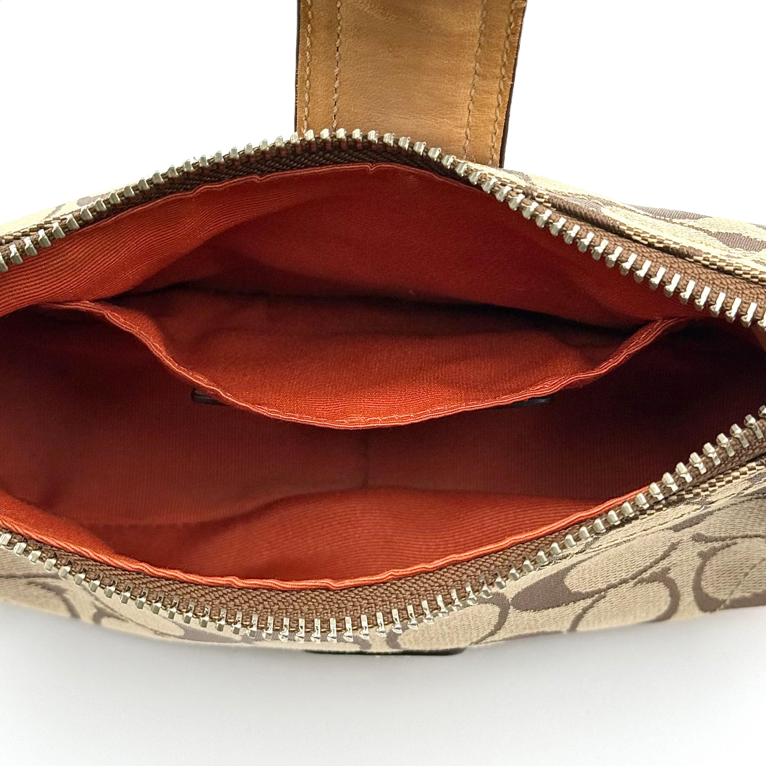 Coach Soho Demi shoulder bag in beige and tan monogram canvas with leather trim and buckle detail.