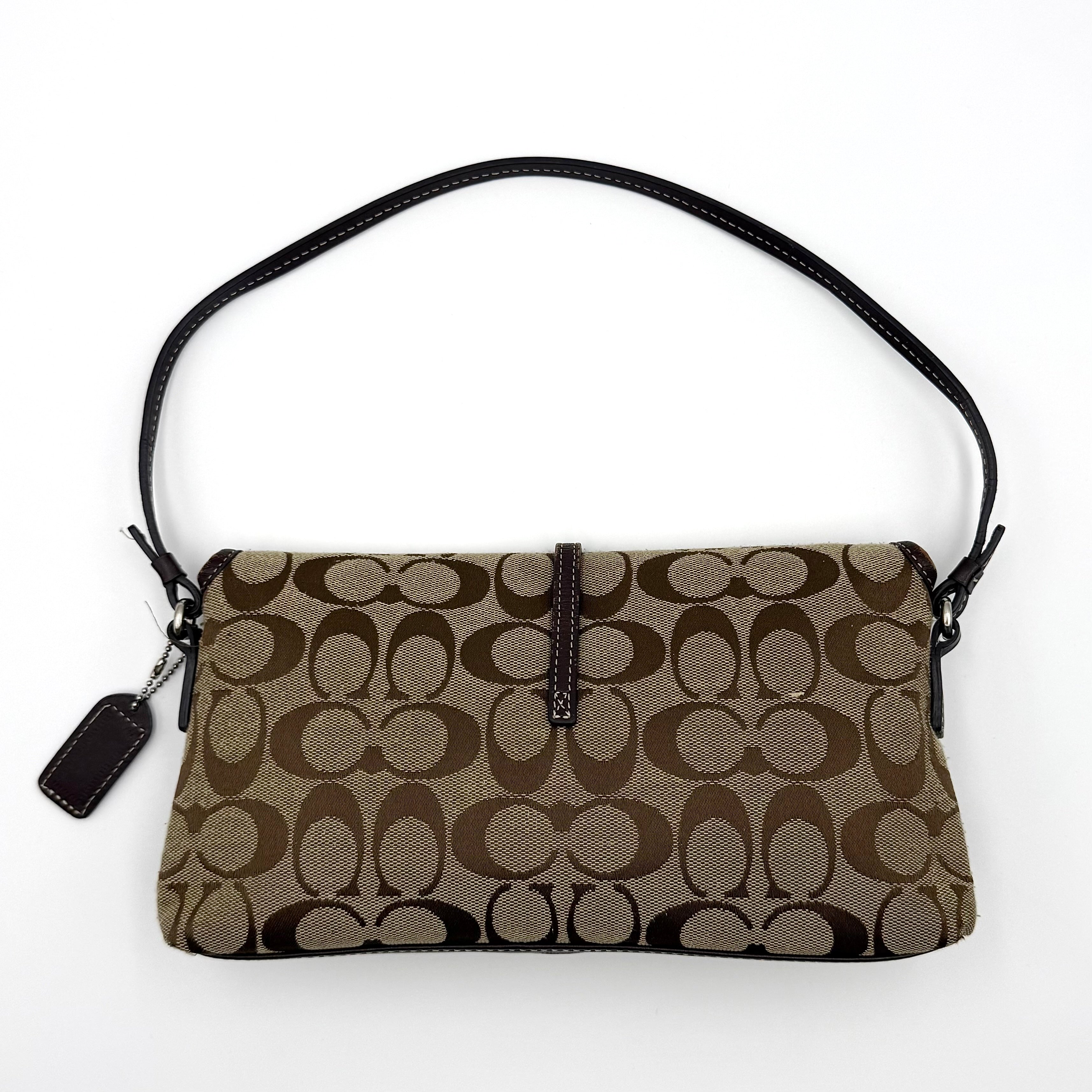 Coach Y2K Demi Clip Baguette in beige and brown canvas with leather trim, featuring signature monogram and shoulder strap.