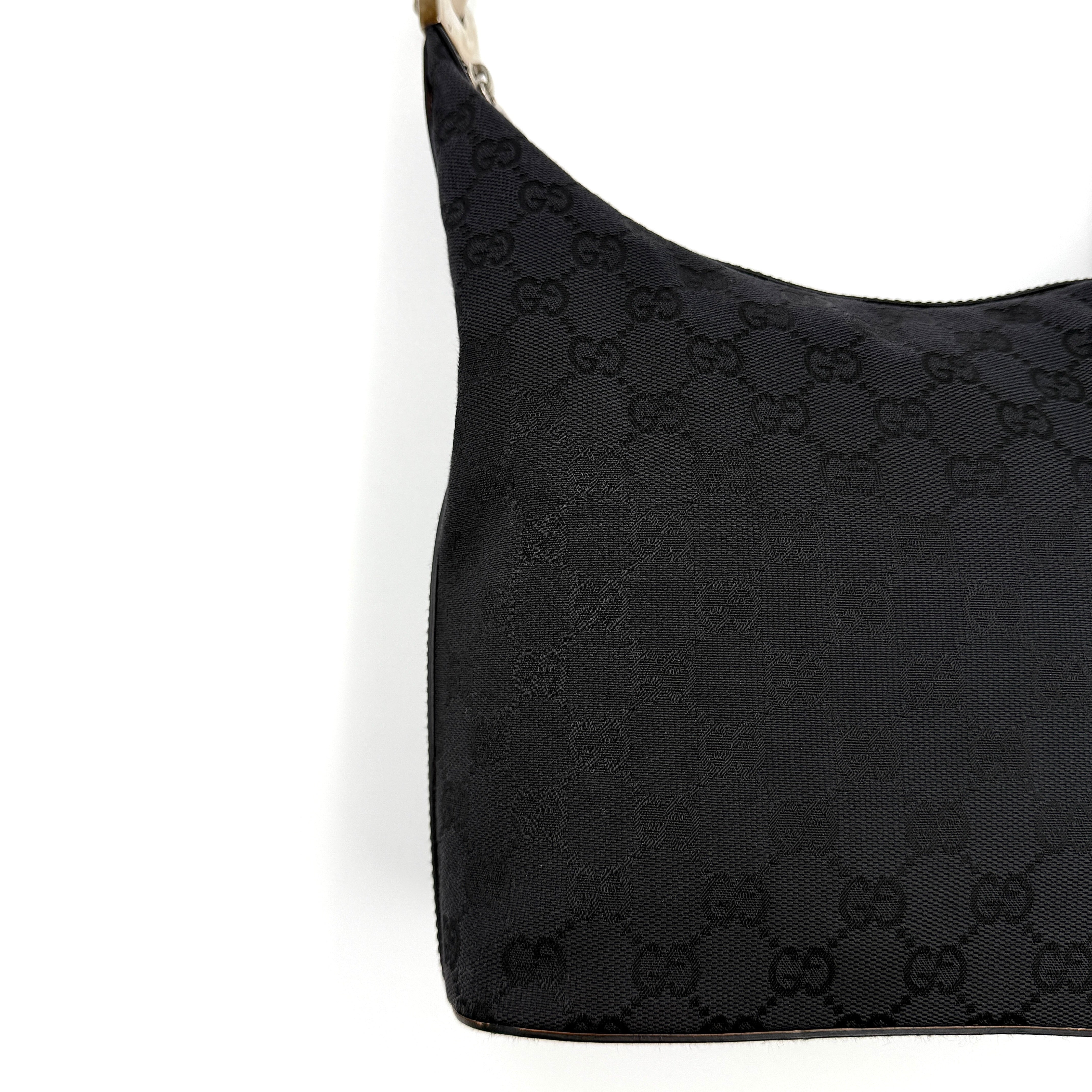 Gucci GG Monogram Hobo Shoulder Bag in black canvas with tonal GG logo pattern, silver-tone hardware and a single top handle.