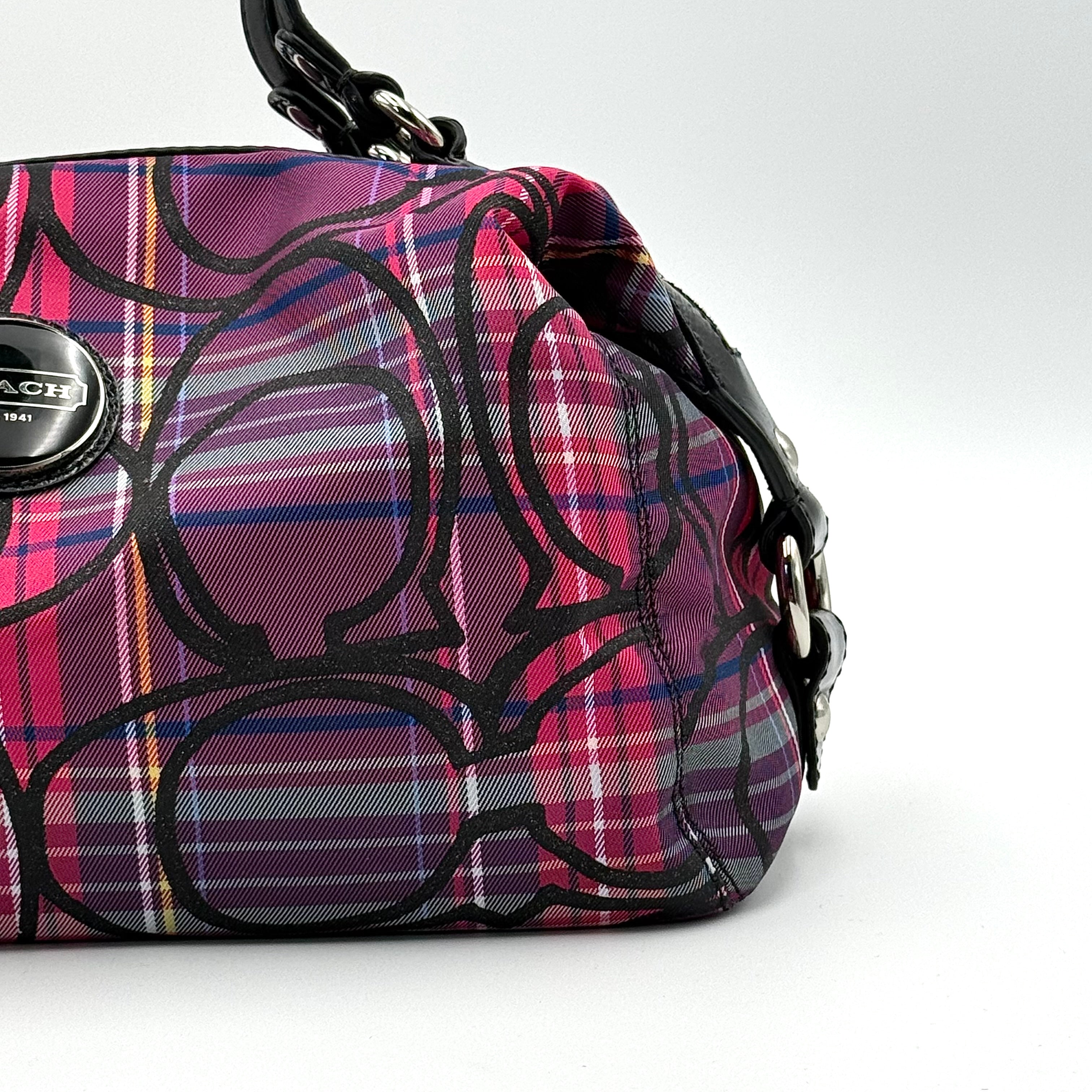Coach Signature Poppy Tartan Shoulder Bag in vibrant multi plaid with bold black logo print, featuring black patent trim and silver hardware.